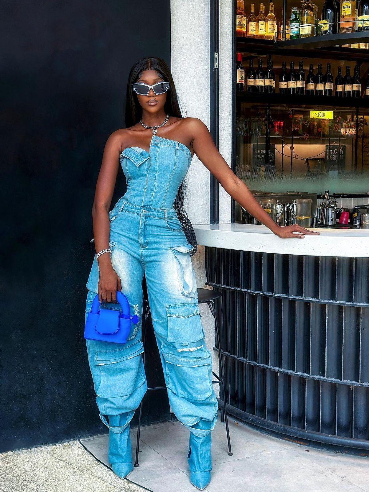 Eden Strapless Pocket Denim Jumpsuit in Blue, showcasing a chic bandeau silhouette and pocket details.