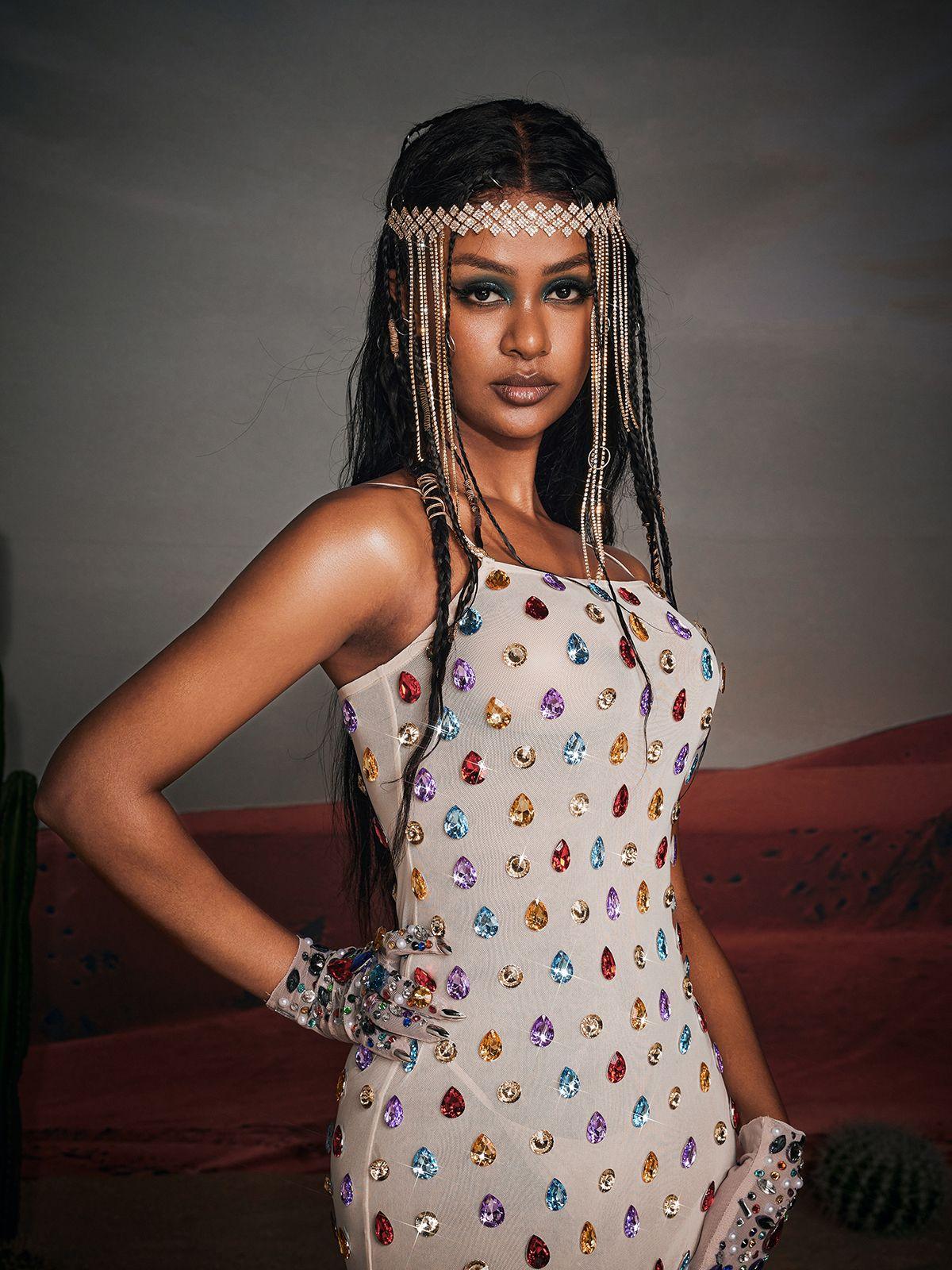 Edgar Spaghetti Rhinestone Mini Dress in nude with sparkling rhinestones and adjustable spaghetti straps, perfect for evening wear.