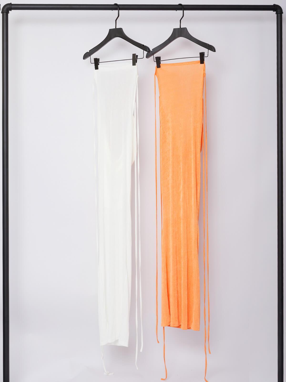 Elegant orange backless maxi dress with drape detail, ideal for special occasions.