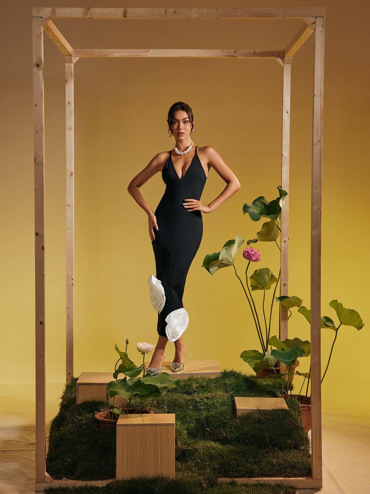 Model showcasing the Elihu Spaghetti Flower Bandage Midi Dress, emphasizing its feminine style and flattering silhouette.