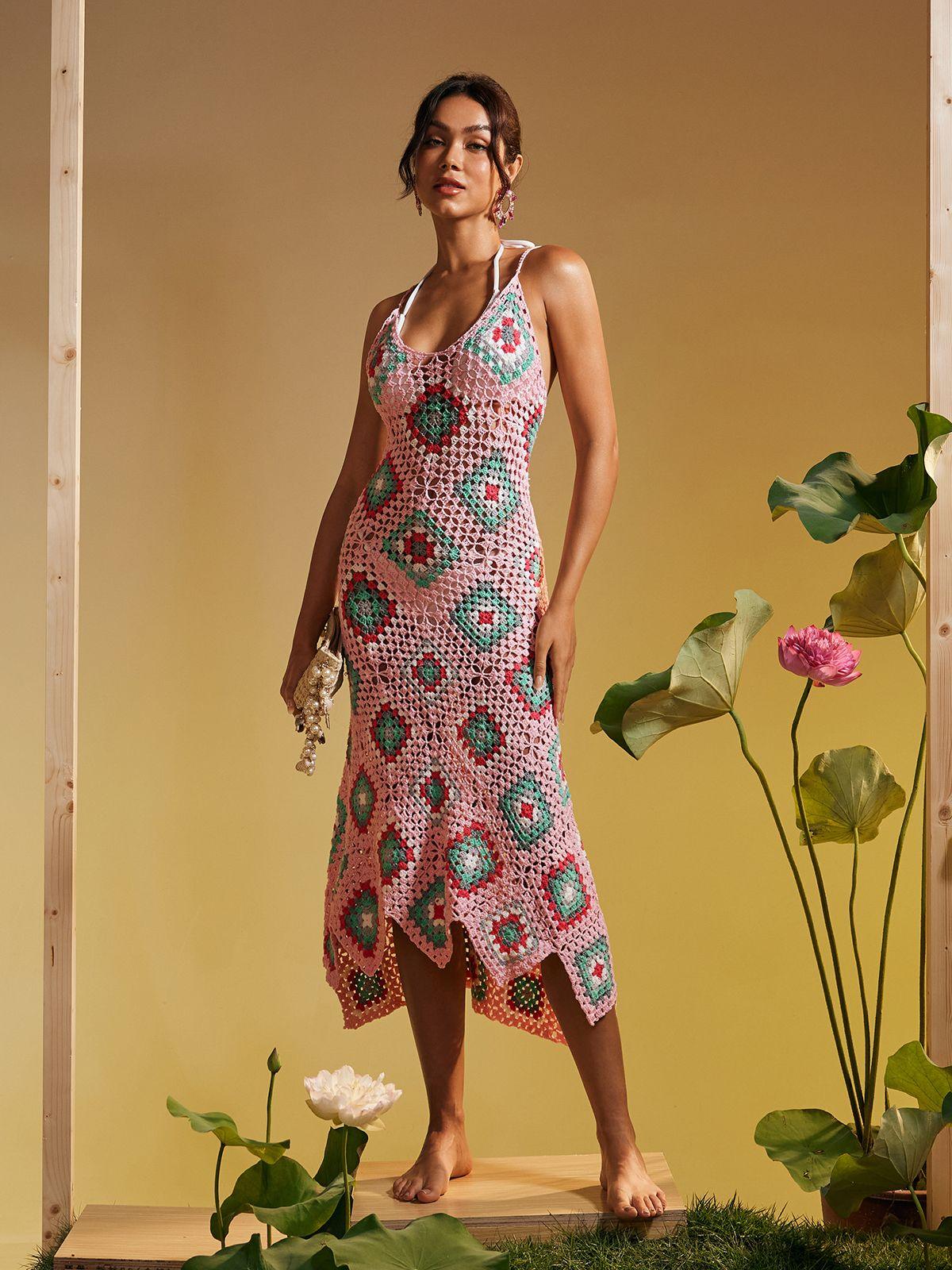 Eliora Open Back Hollow Knitted Midi Dress in pink with elegant design and hollow details, perfect for stylish vacations.