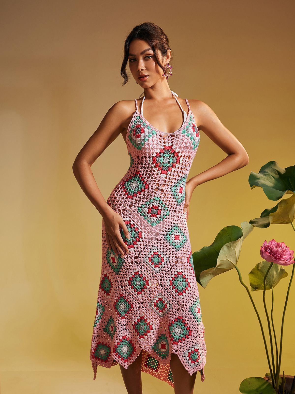 Eliora Open Back Hollow Knitted Midi Dress in pink with elegant design and hollow details, perfect for stylish vacations.