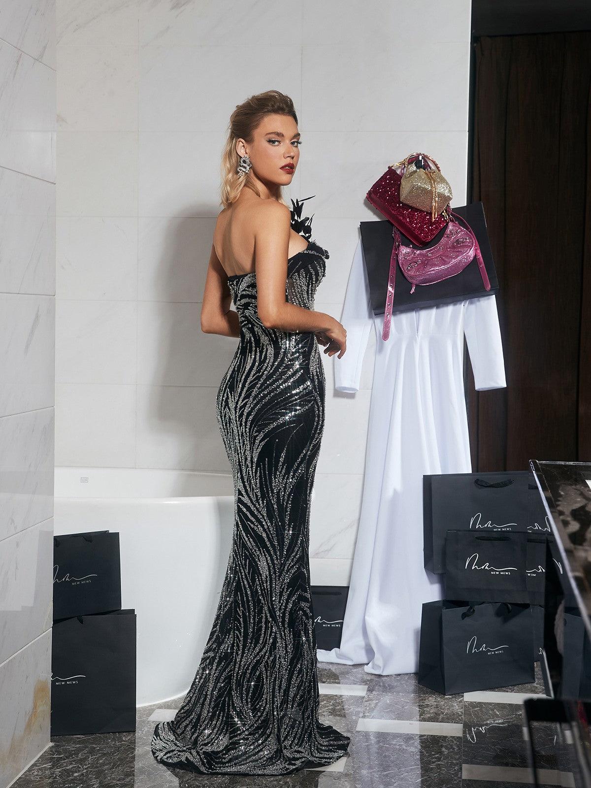 Ellery Strapless Sequin Feather Maxi Dress featuring exquisite feather details and vibrant sequins, perfect for elegant occasions.