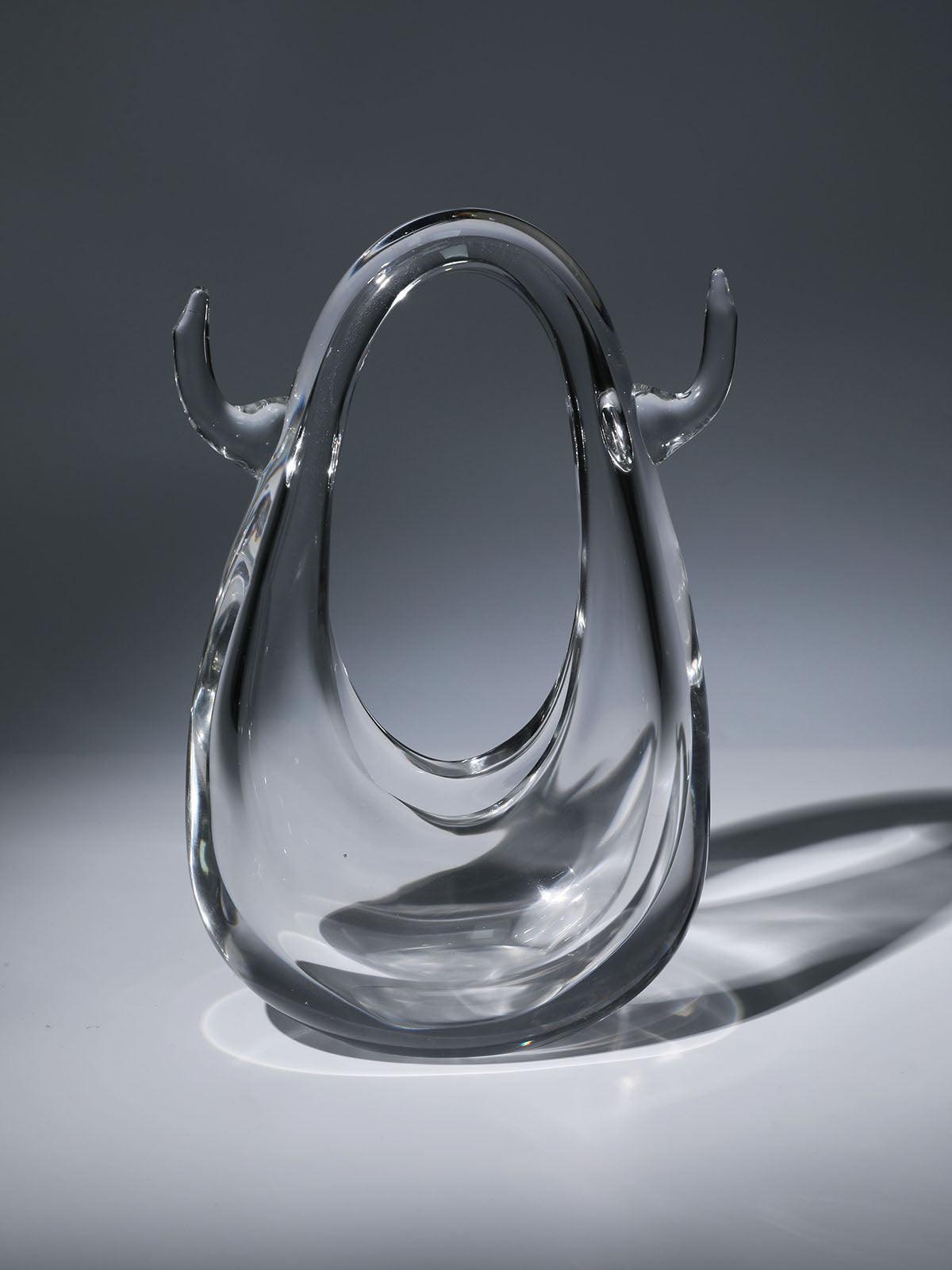 Elvira Clear Glass Bag showcasing its elegant design and transparent material, perfect for any stylish outfit.