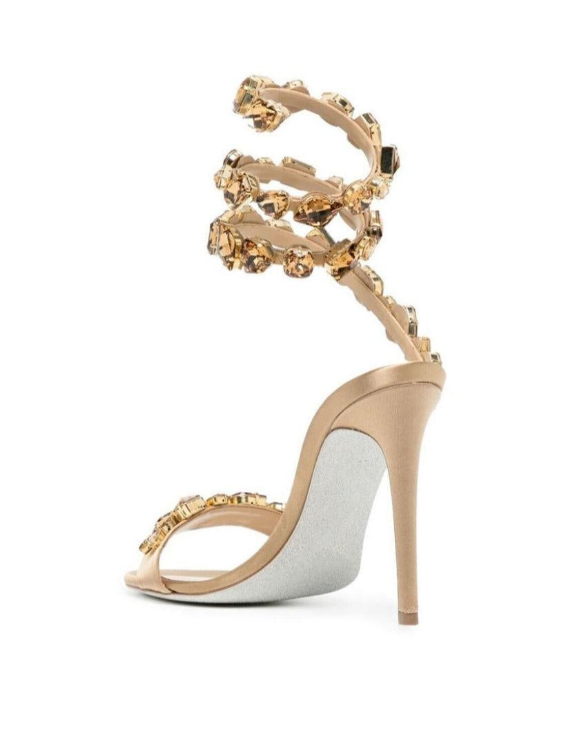 Elyra Snake Rhinestone Sandals in Gold featuring stylish adjustable straps and elegant rhinestone detailing.