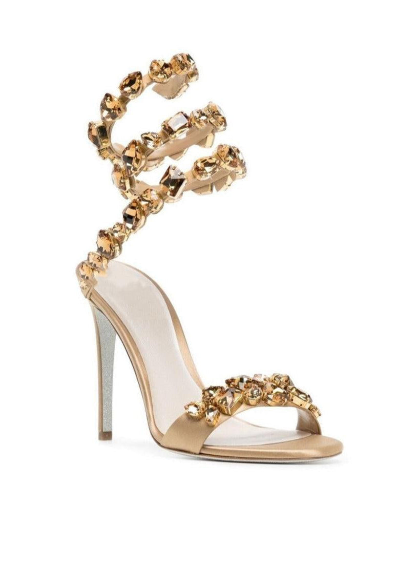 Elyra Snake Rhinestone Sandals in Gold featuring stylish adjustable straps and elegant rhinestone detailing.