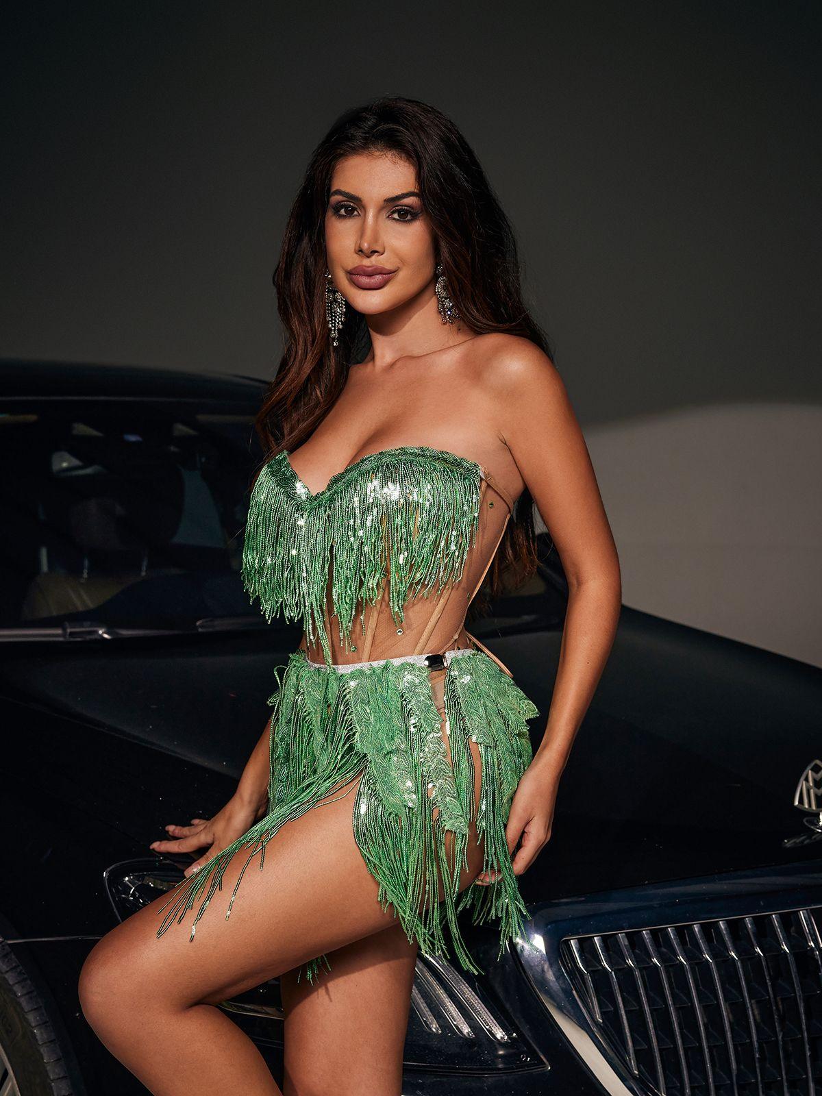 Model posing in the Emani Corset Glitter Fringe Bodysuit, highlighting the eye-catching fringe and sophisticated corset structure.