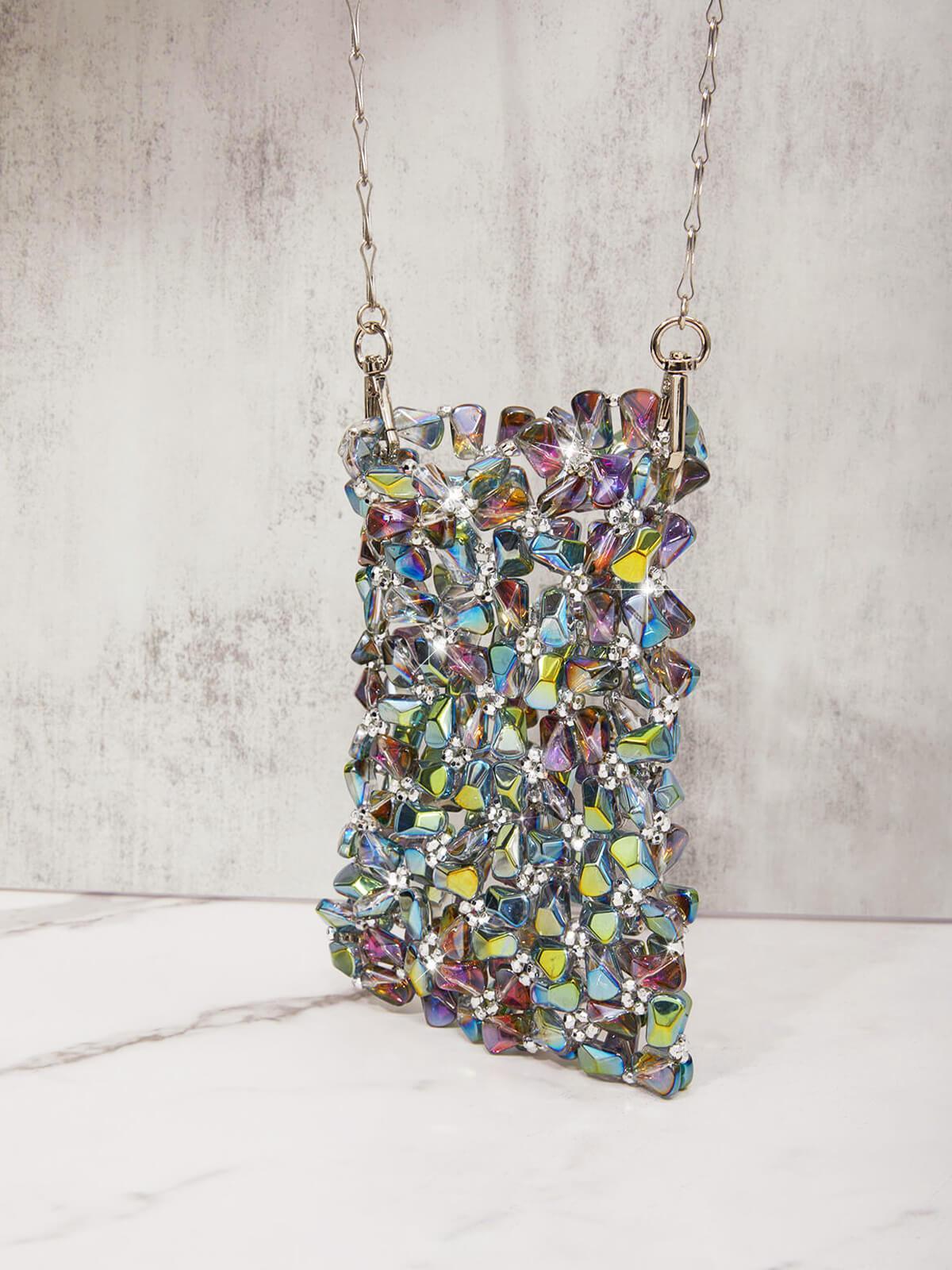 Showing the versatility of the Erica Multi Crystal Cutout Bag styled with various outfits.