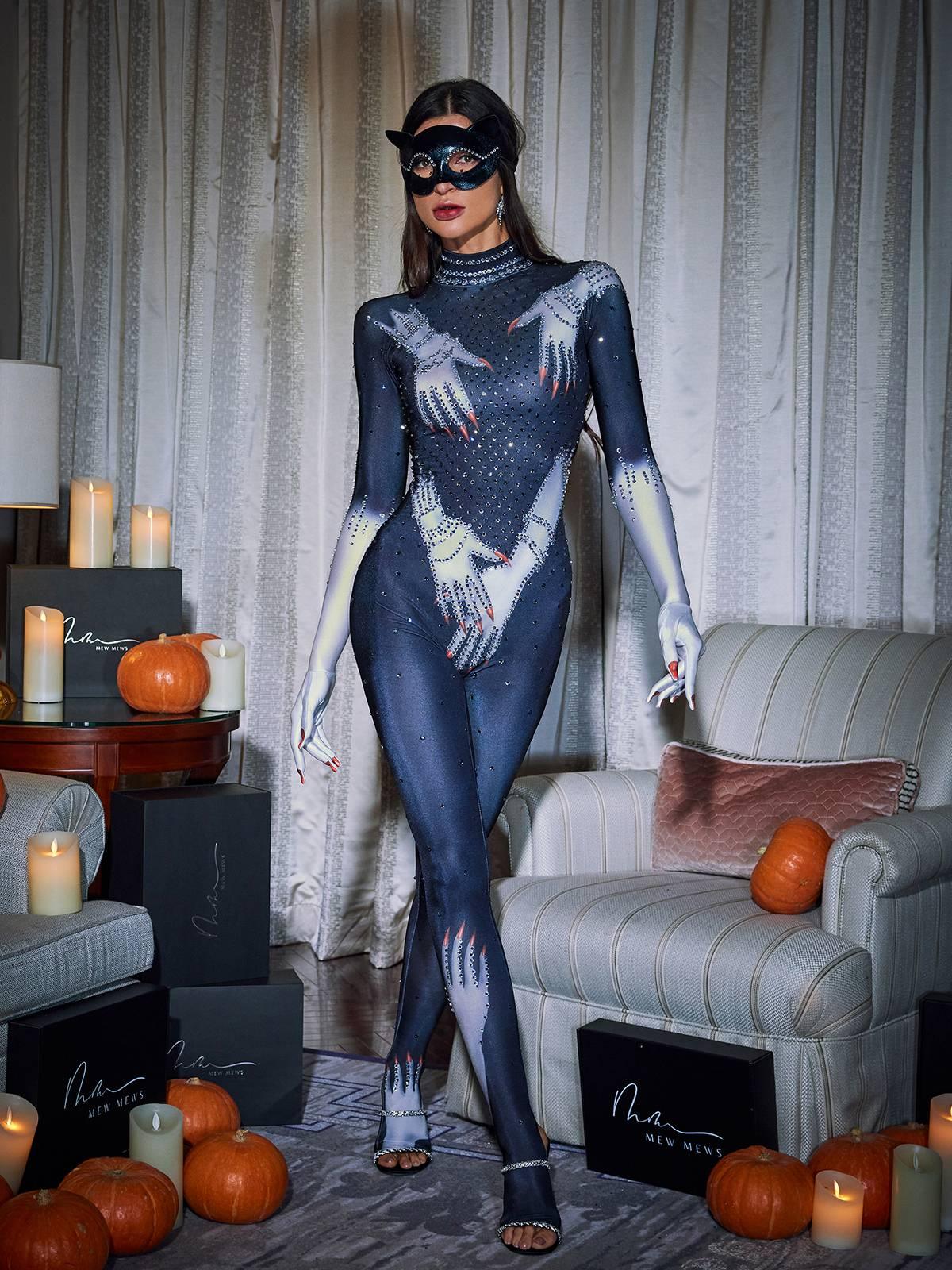 A model showcasing the comfortable fit of the black jumpsuit, perfect for evening wear.