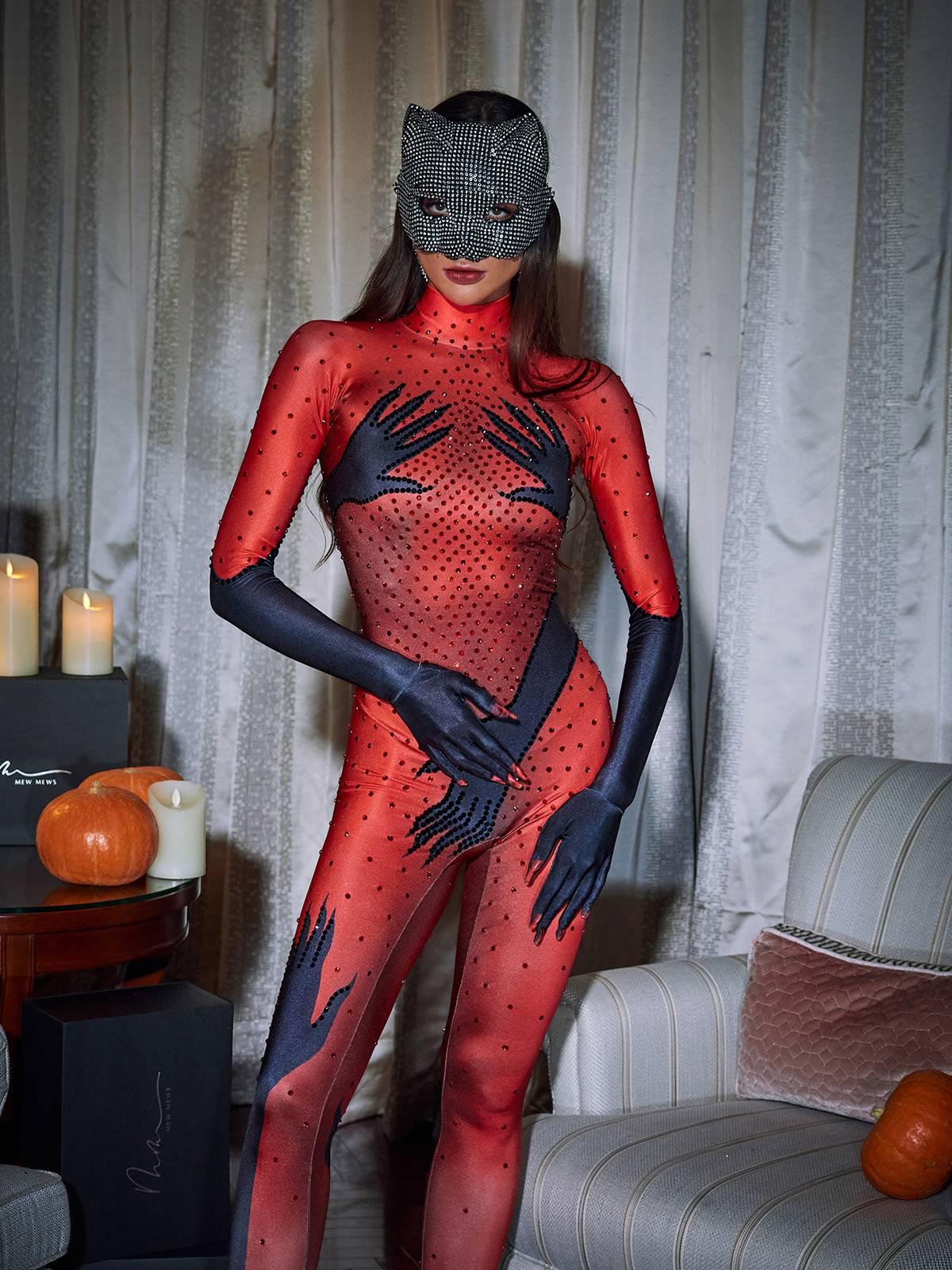 Stylish display of the Esau Hands Printed Jumpsuit on a mannequin, emphasizing its comfortable fit and statement appeal.