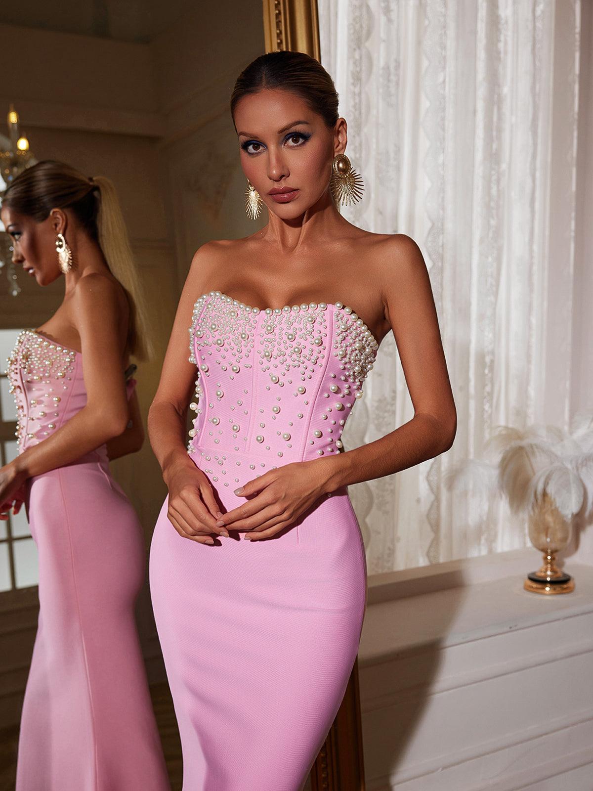 Model wearing the Everett Strapless Pearl Bandage Dress at a cocktail party, showcasing its elegant design and flattering fit.