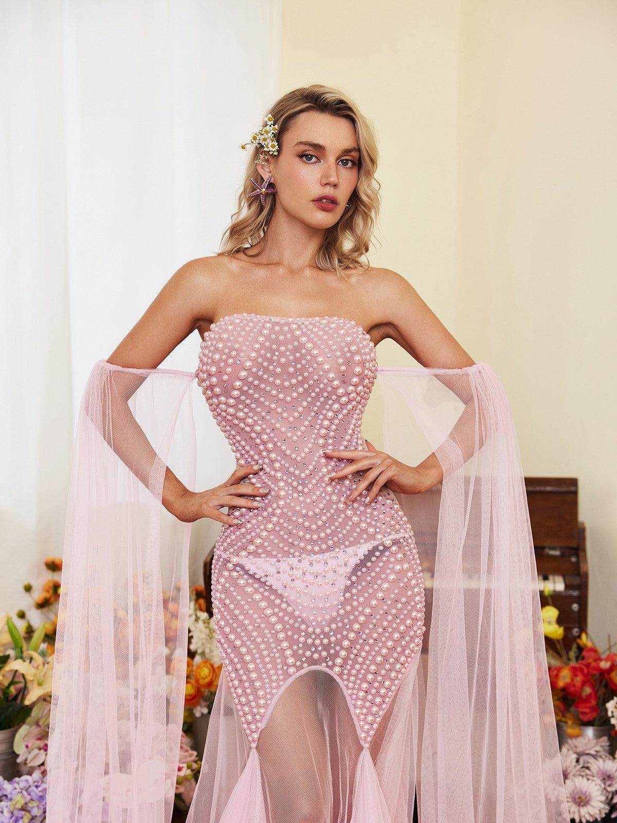 Evren Pearl Embellished Tulle Maxi Dress in pink, showcasing elegant off-shoulder design and luxurious pearl embellishments.