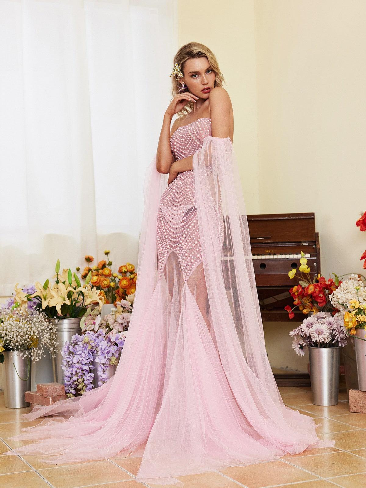 Evren Pearl Embellished Tulle Maxi Dress in pink, showcasing elegant off-shoulder design and luxurious pearl embellishments.