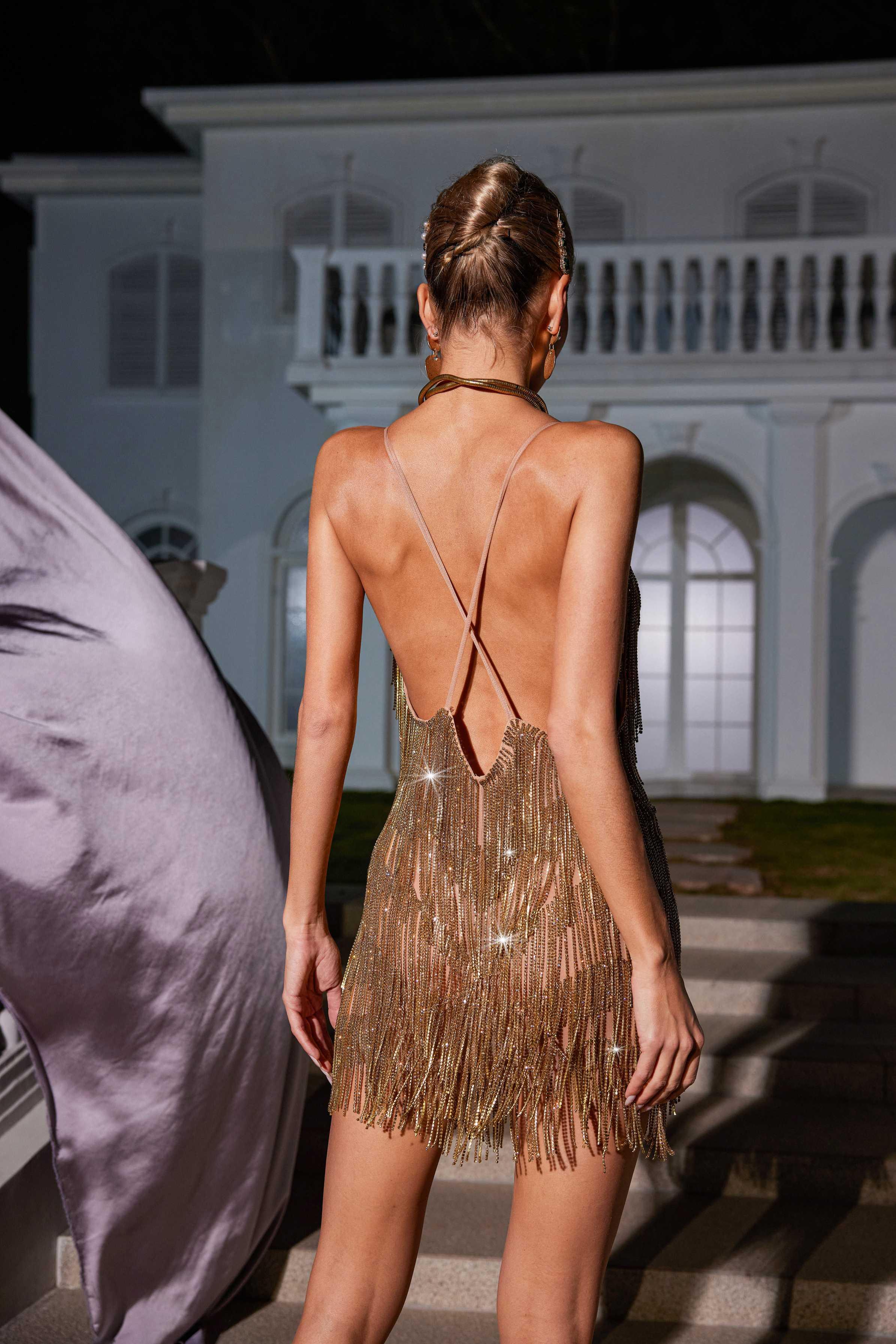 Fiadh Crystal Chain Fringe Mini Dress in Gold showcasing elegant design and backless detail.