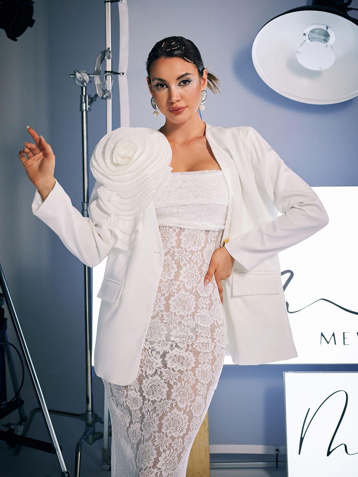 Finnley V Neck Flower Blazer in white with floral patterns for a stylish outerwear option.