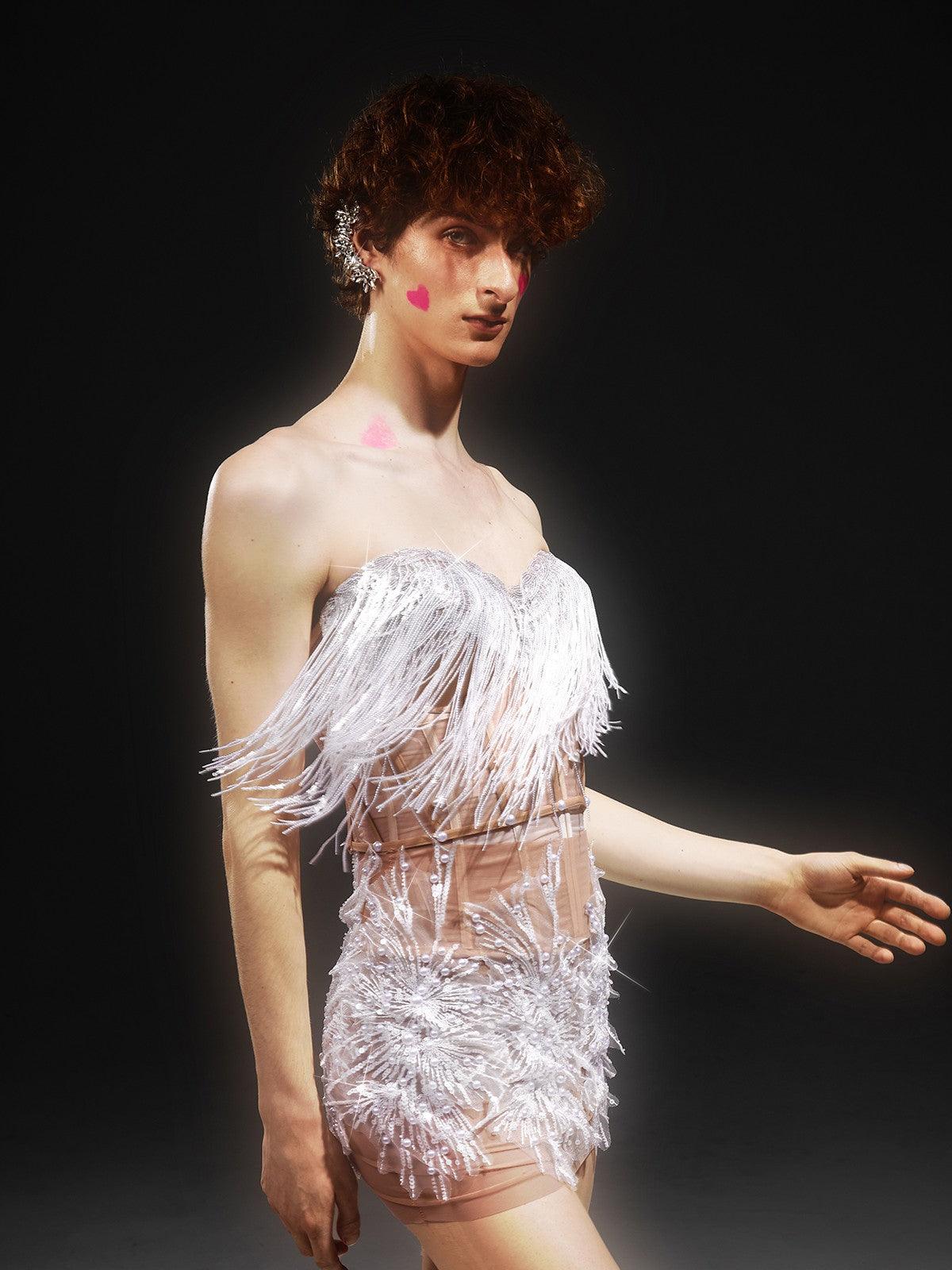 Model wearing the Gadiel Strapless Sequin Corset Mesh Dress at an evening event, exemplifying stylish party attire with a bold statement.