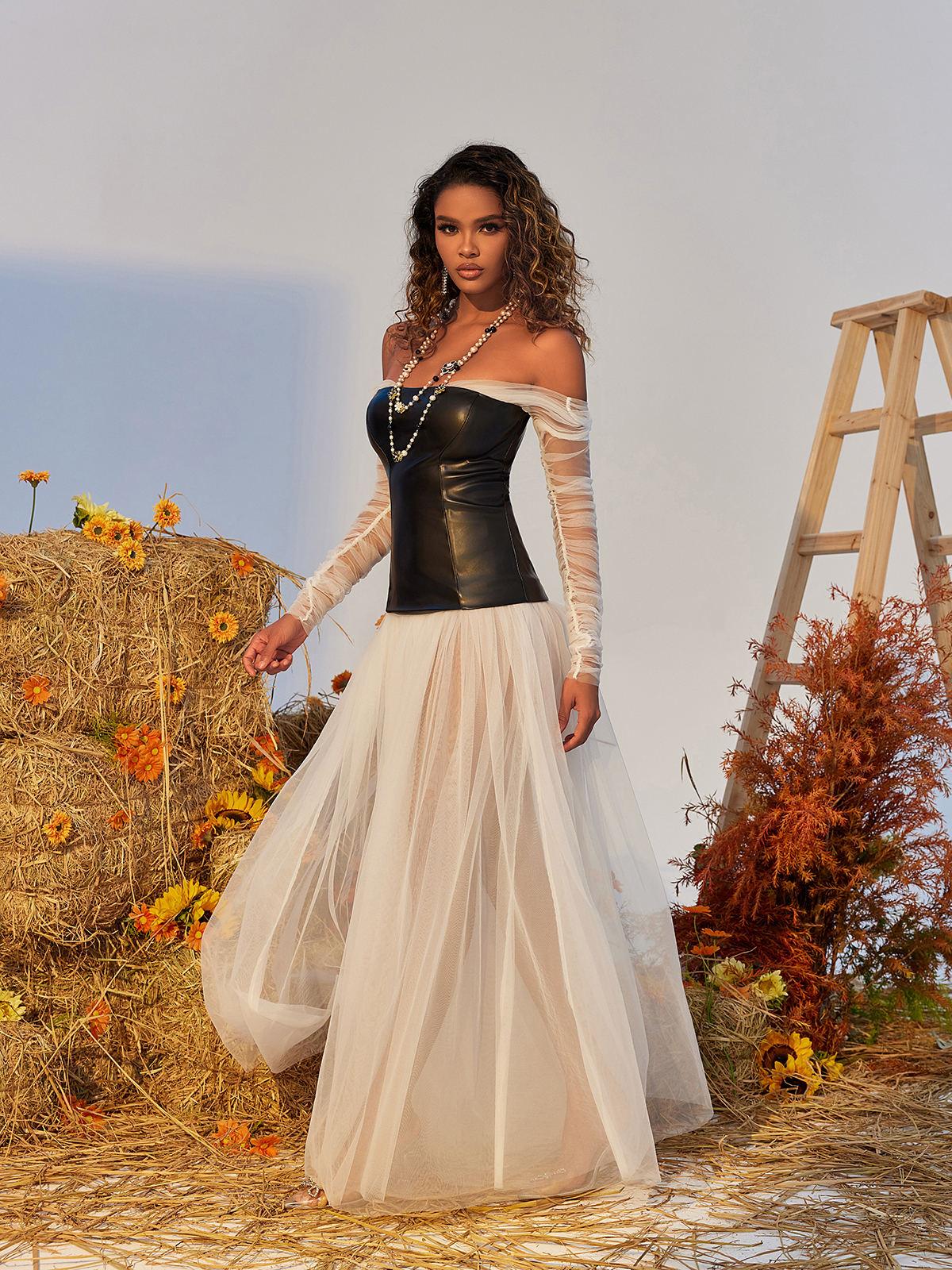 Gasira Tulle Maxi Dress in white featuring airy layers, off-shoulder design, and elegant back zipper for special occasions.
