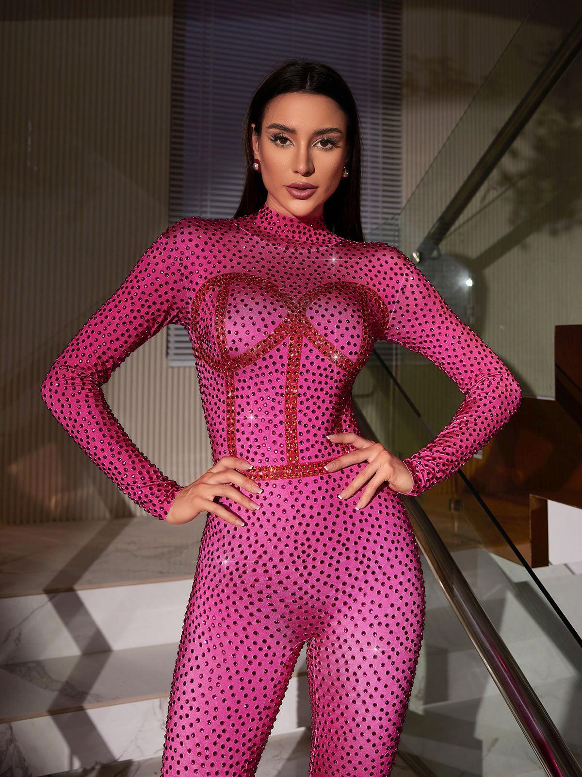 Gelia Body Printed Rhinestone Jumpsuit in pink with embellished details and long sleeves, ideal for fashion-forward occasions.