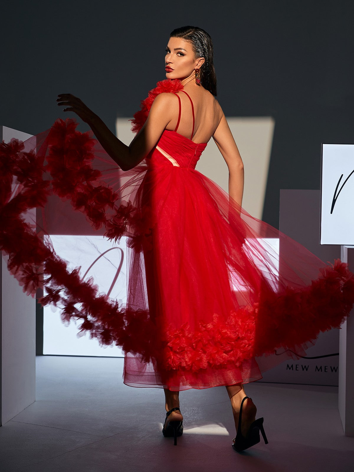Ghslaine One Shoulder Tulle Midi Dress in Red, showcasing its elegant design and lightweight tulle fabric.