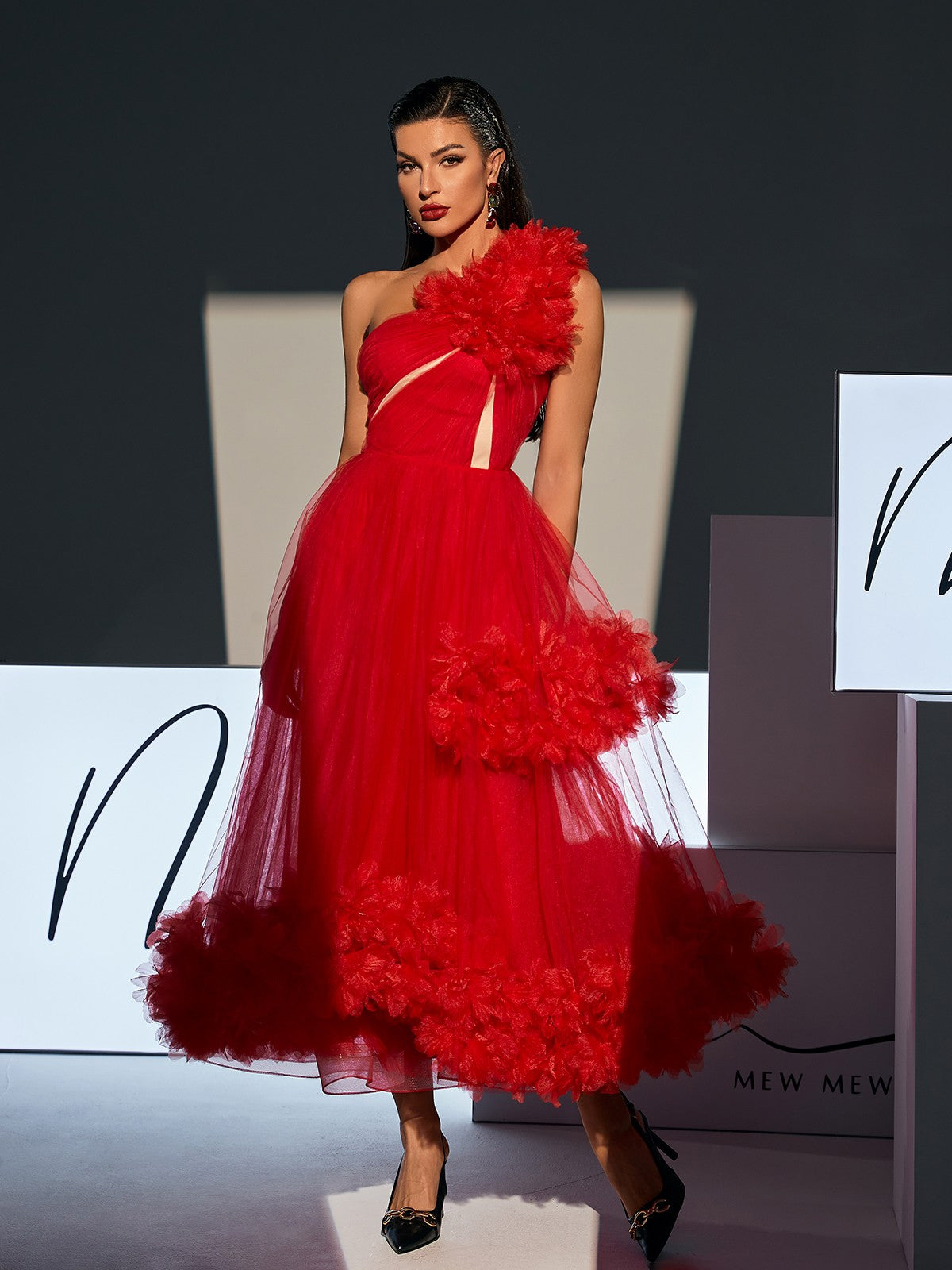 Ghslaine One Shoulder Tulle Midi Dress in Red, showcasing its elegant design and lightweight tulle fabric.