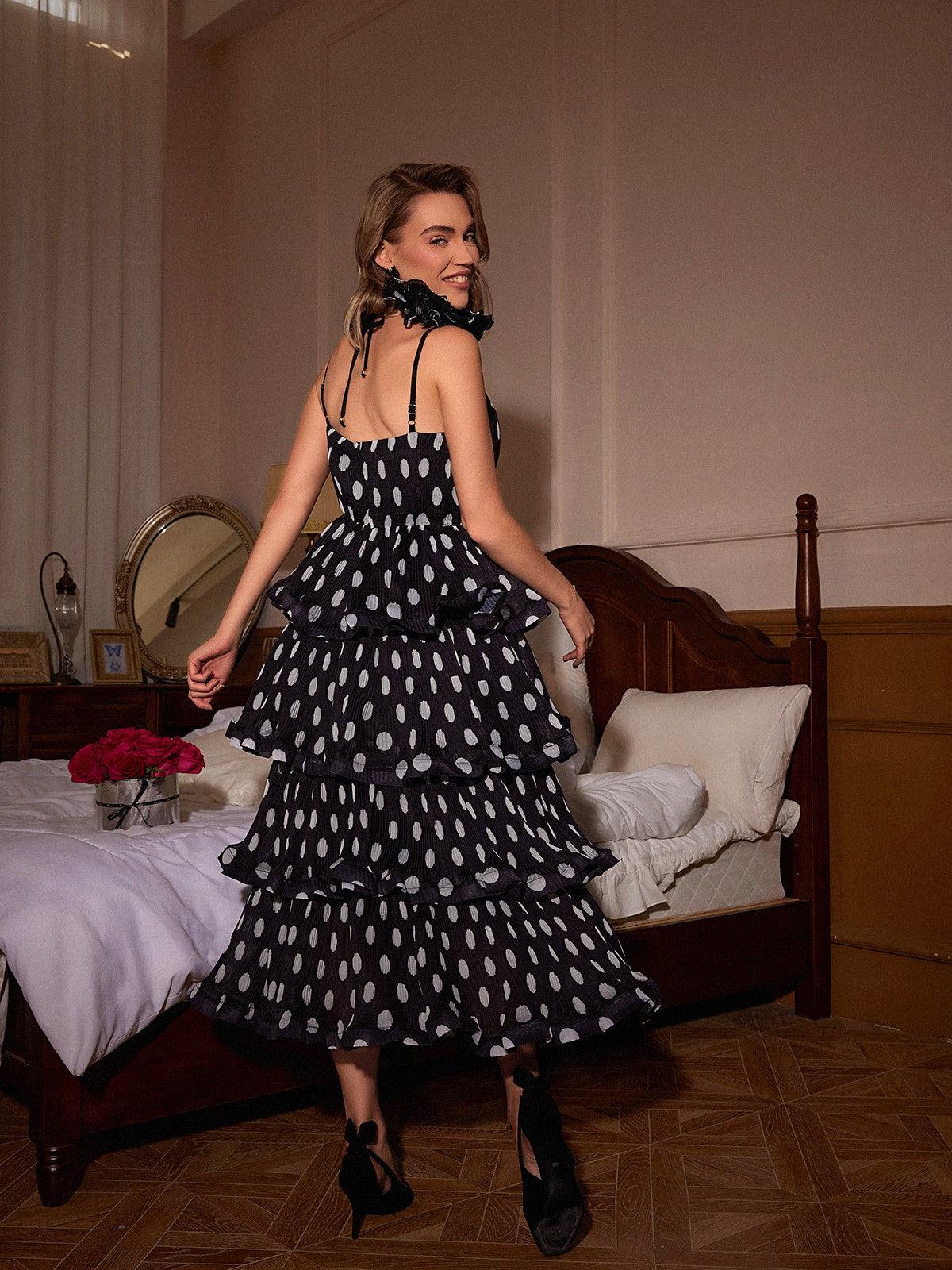 Ilaria Spaghetti Dot Tiered Dress featuring a playful polka dot design and spaghetti straps, ideal for summer gatherings.