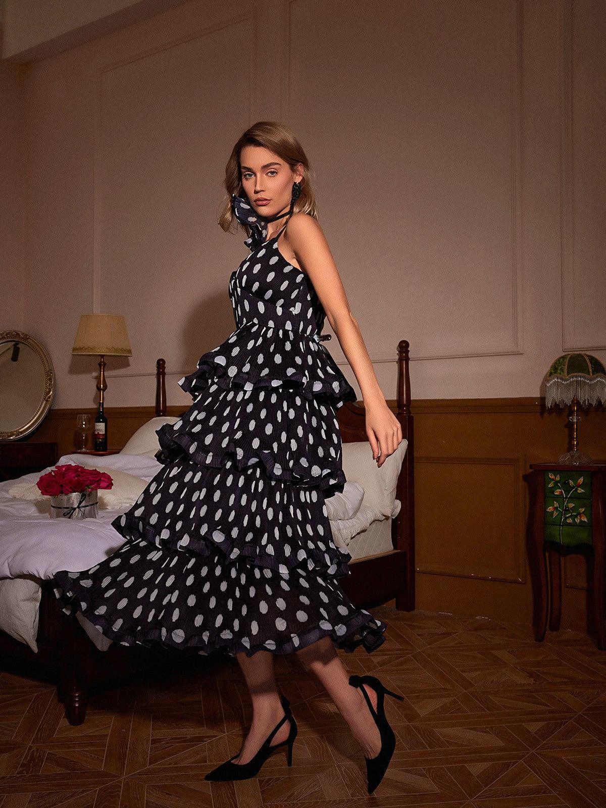 Ilaria Spaghetti Dot Tiered Dress featuring a playful polka dot design and spaghetti straps, ideal for summer gatherings.