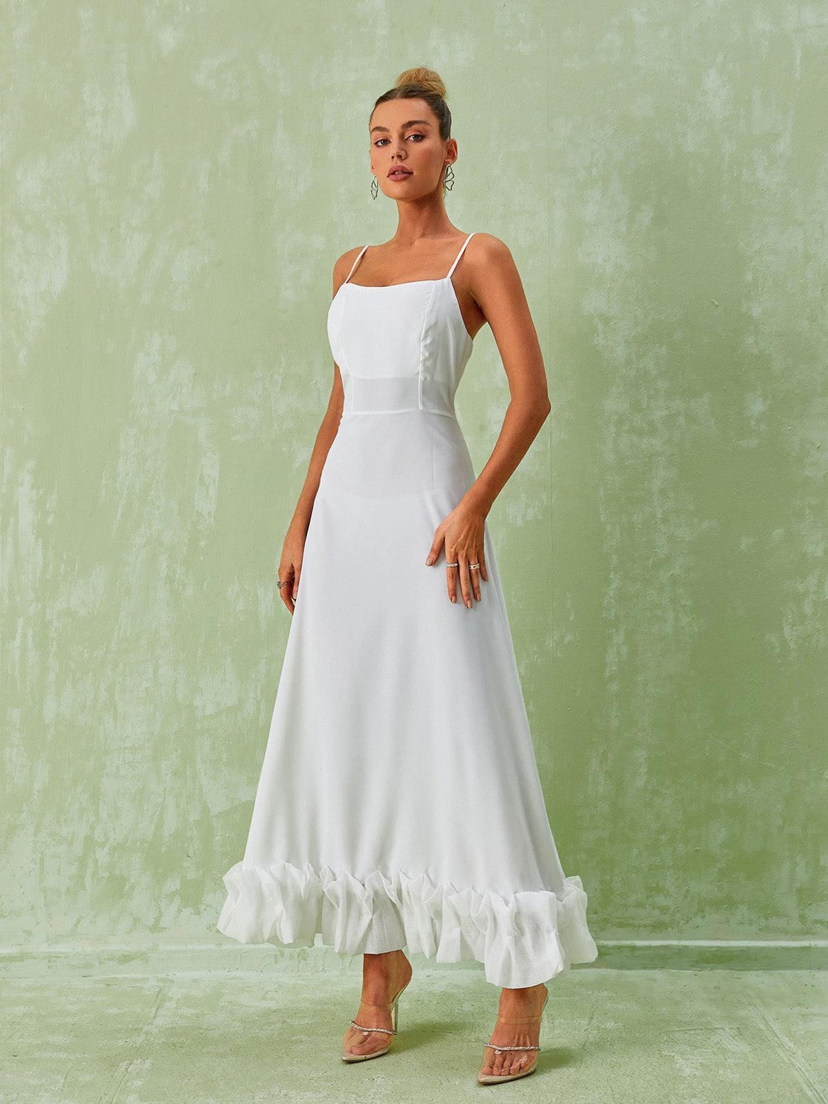 Elegant Ilsa Spaghetti Maxi Dress in White featuring a floral hem, ideal for summer vacations and formal events.