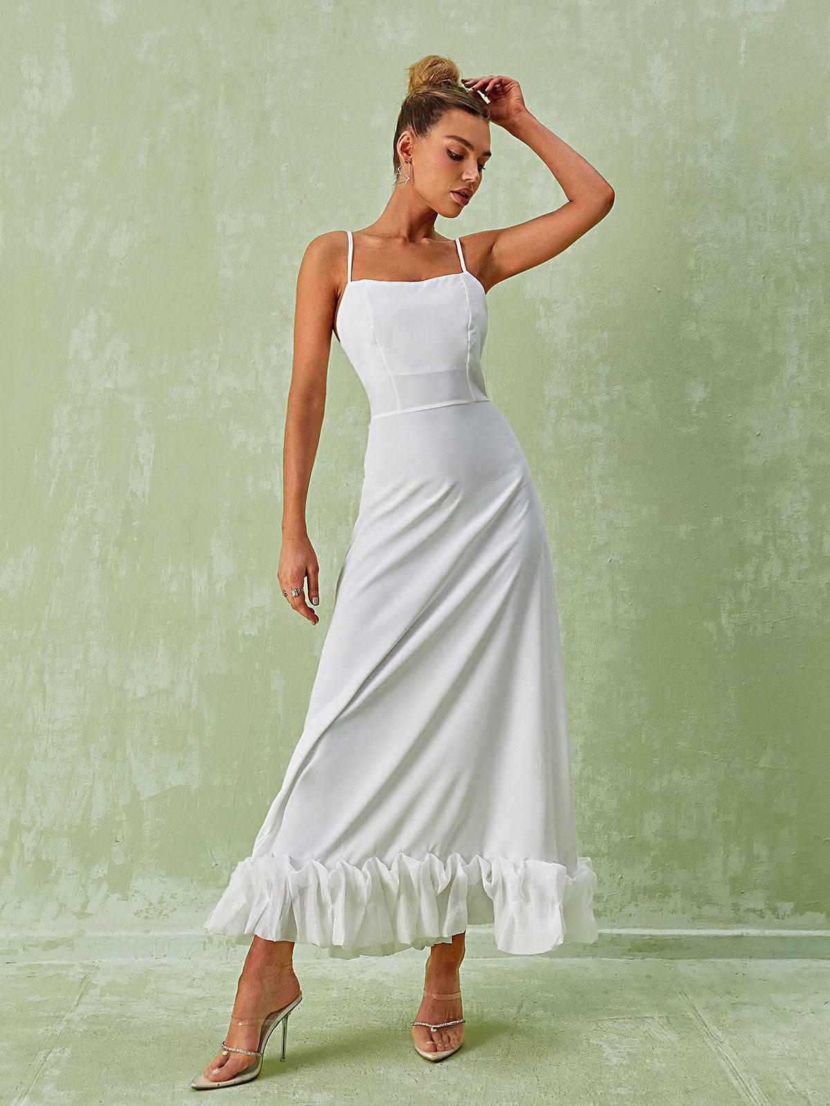 Elegant Ilsa Spaghetti Maxi Dress in White featuring a floral hem, ideal for summer vacations and formal events.