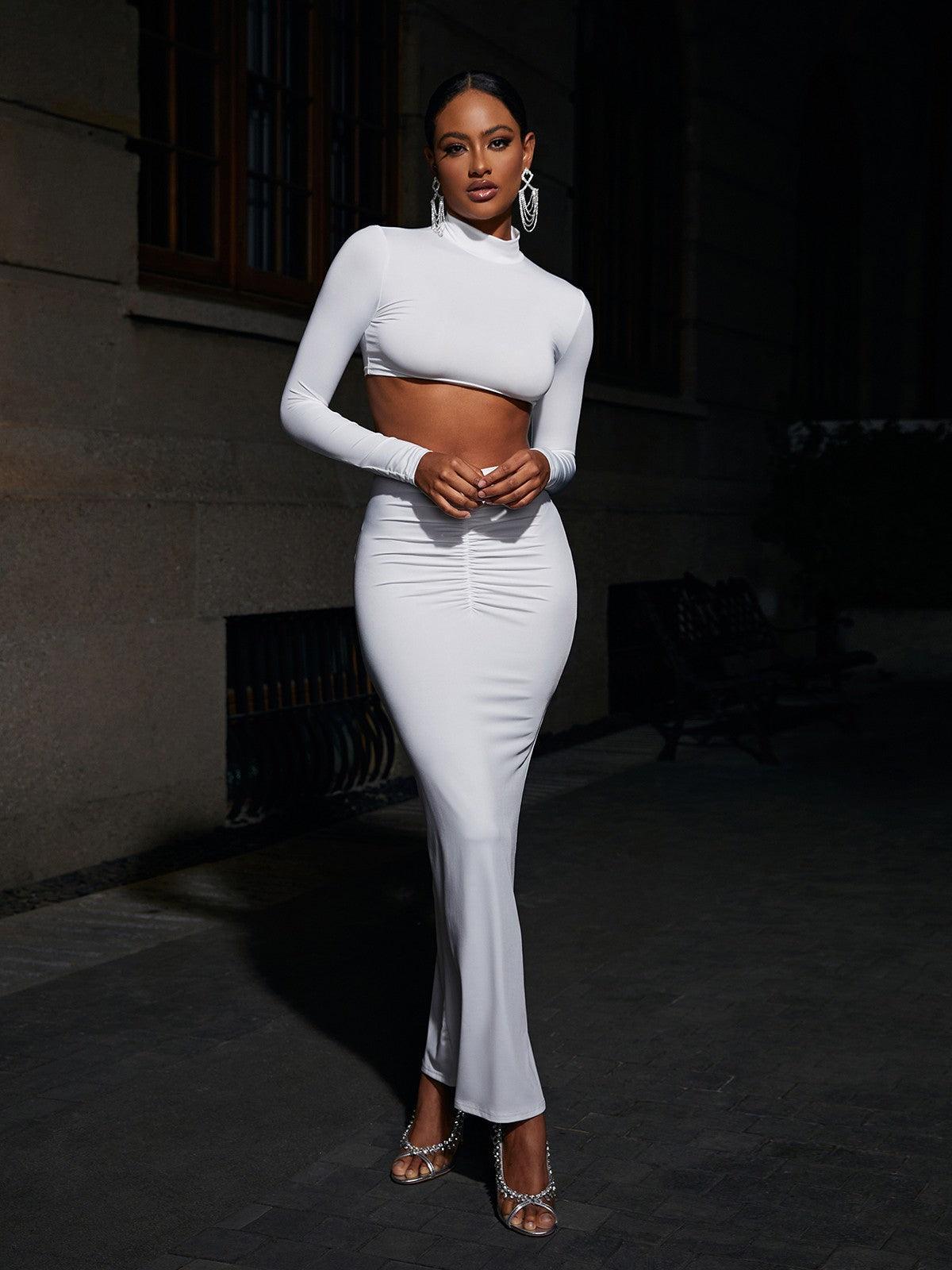 Imani Long Sleeve Ruched Skirt Set featuring a stylish crop top and maxi skirt in white, perfect for elegant occasions and vacations.