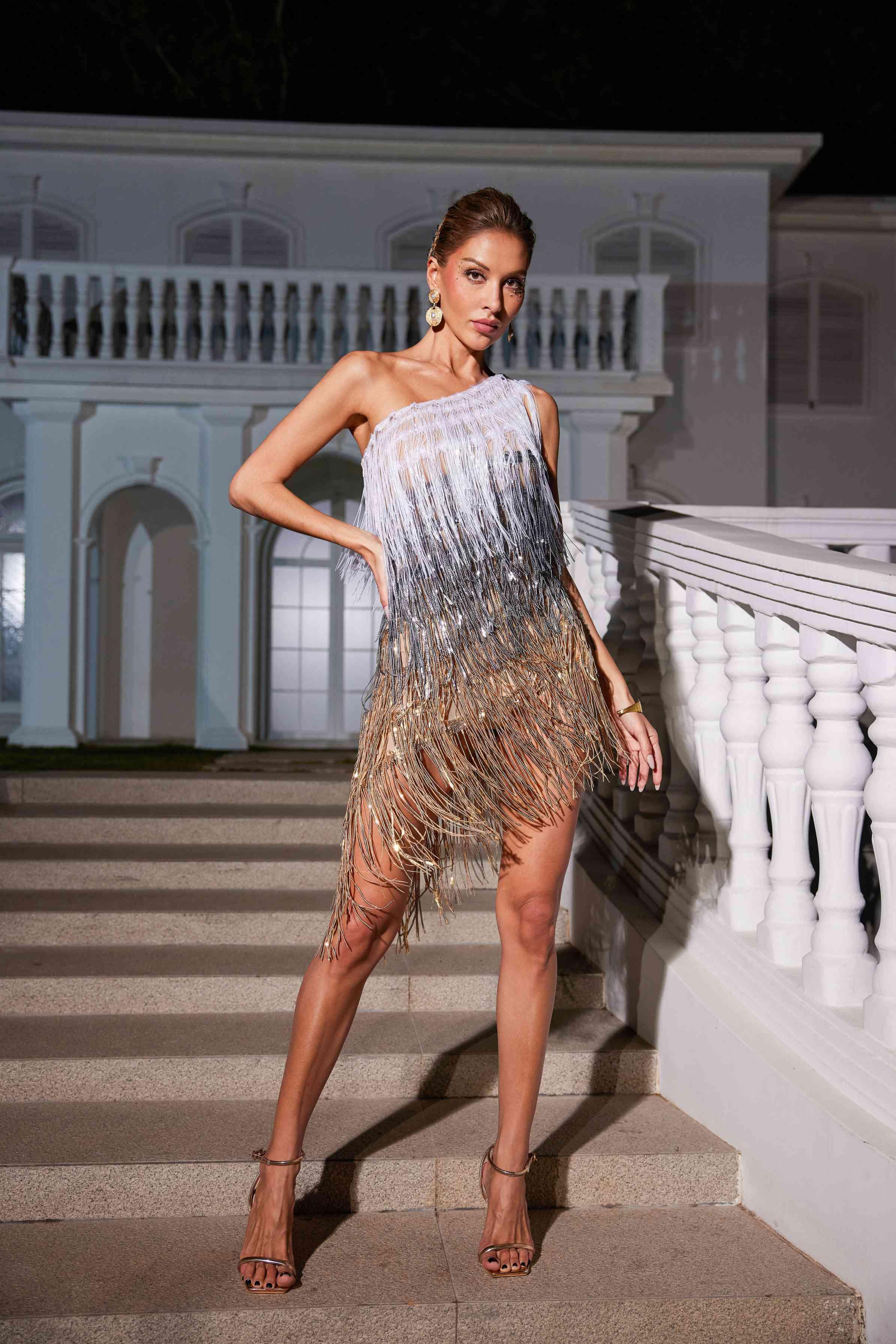 Imre One Shoulder Fringe Sequin Dress featuring gold sequins and fringe detail, perfect for upscale cocktails and events.