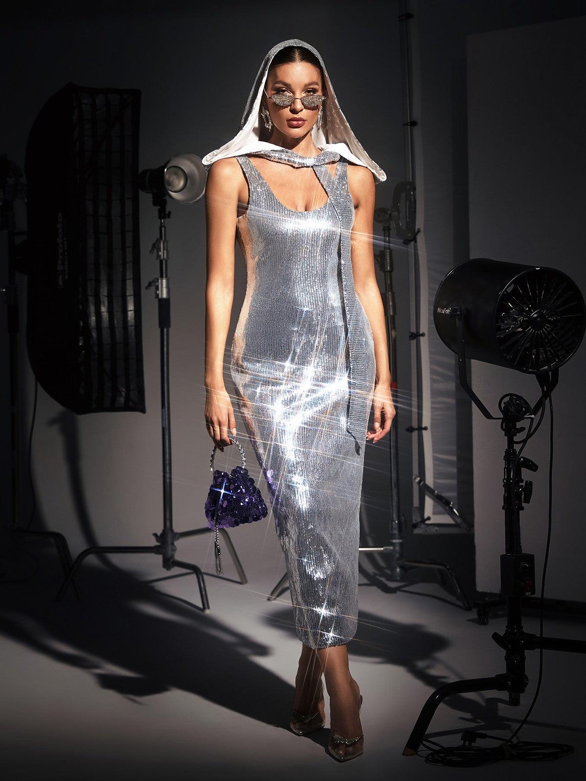 Jafna Drape Back Silver Sequin Hooded Dress featuring a chic design and shimmering sequins, ideal for cocktail events.