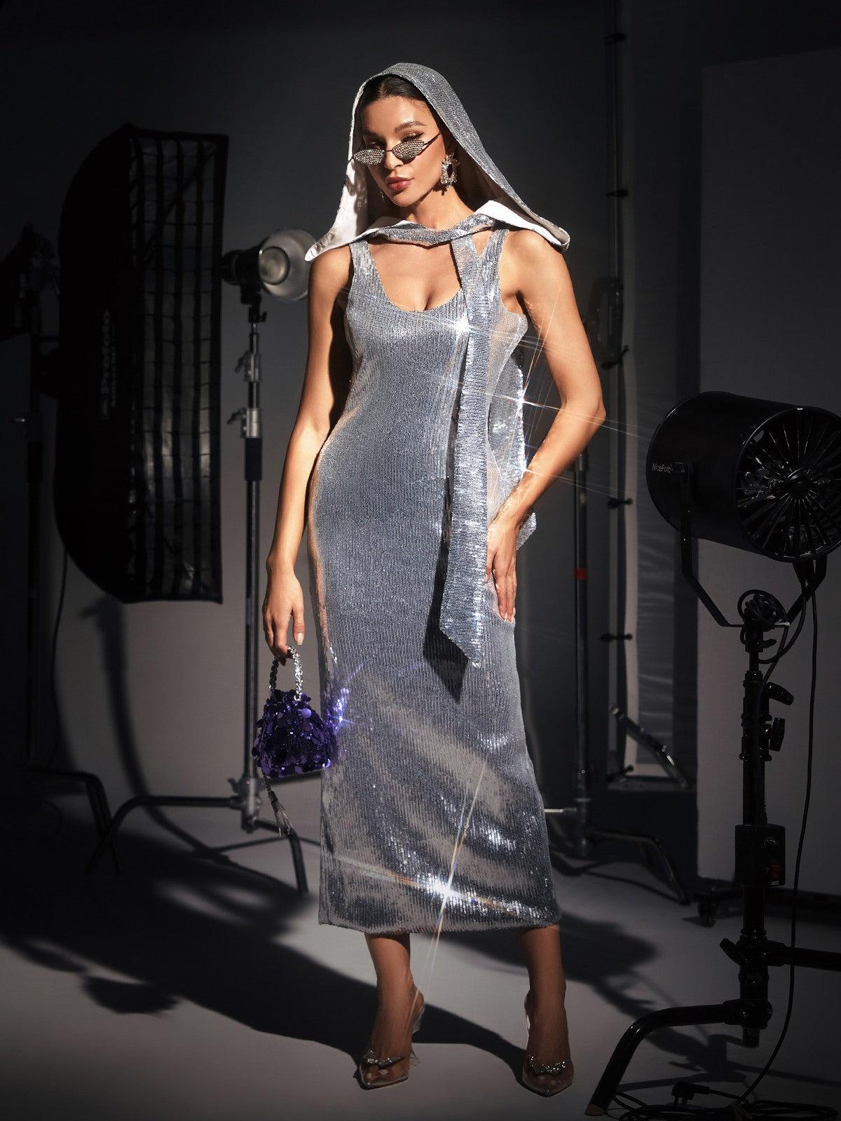 Jafna Drape Back Silver Sequin Hooded Dress featuring a chic design and shimmering sequins, ideal for cocktail events.