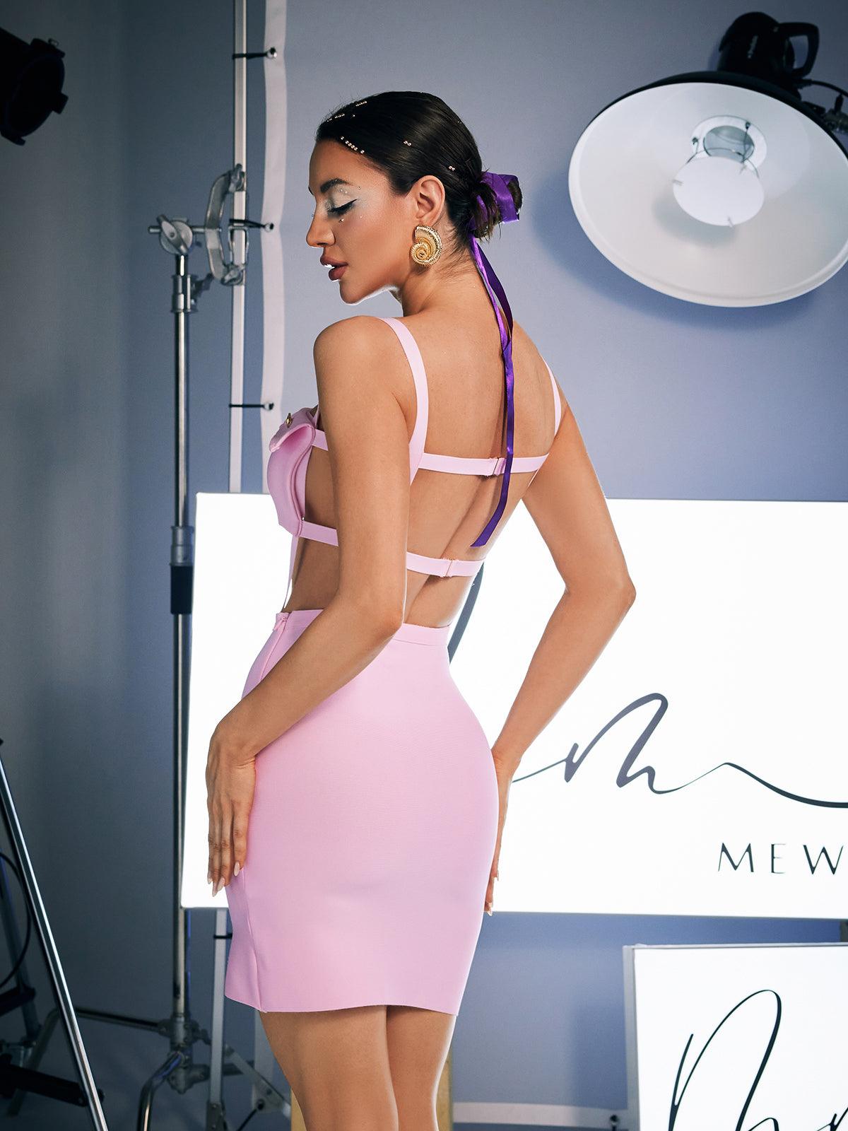 Elegant pink Jehu Spaghetti Hollow Bandage Dress featuring spaghetti straps and a unique hollow design.