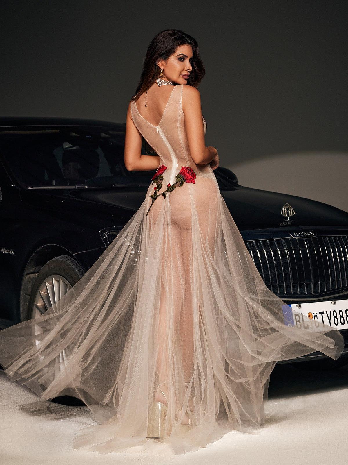 Elegant Kateri V-neck maxi dress in nude mesh with exquisite floral embroidery.  A sophisticated and romantic choice for weddings, parties, and special occasions.