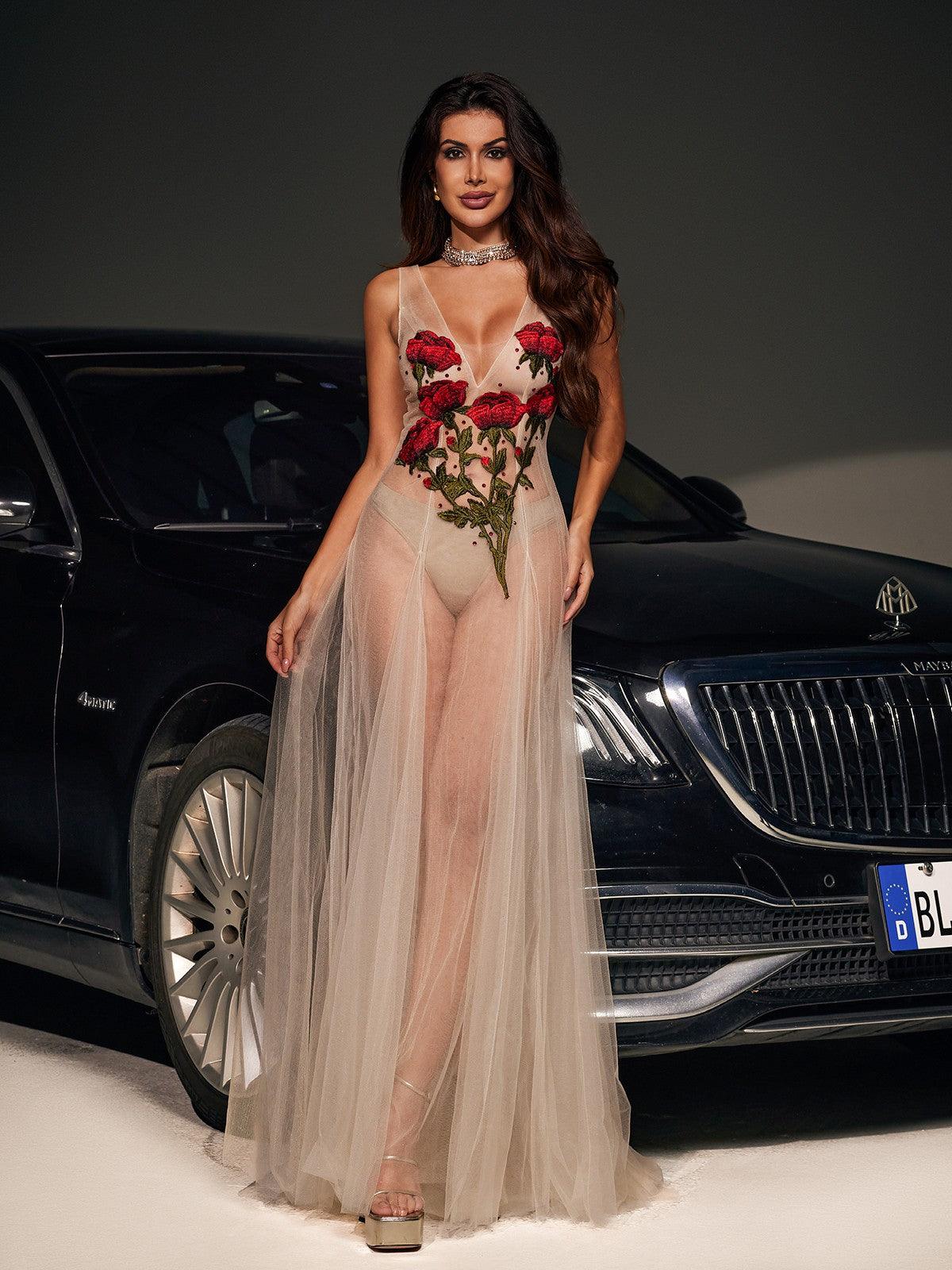 Elegant Kateri V-neck maxi dress in nude mesh with exquisite floral embroidery.  A sophisticated and romantic choice for weddings, parties, and special occasions.