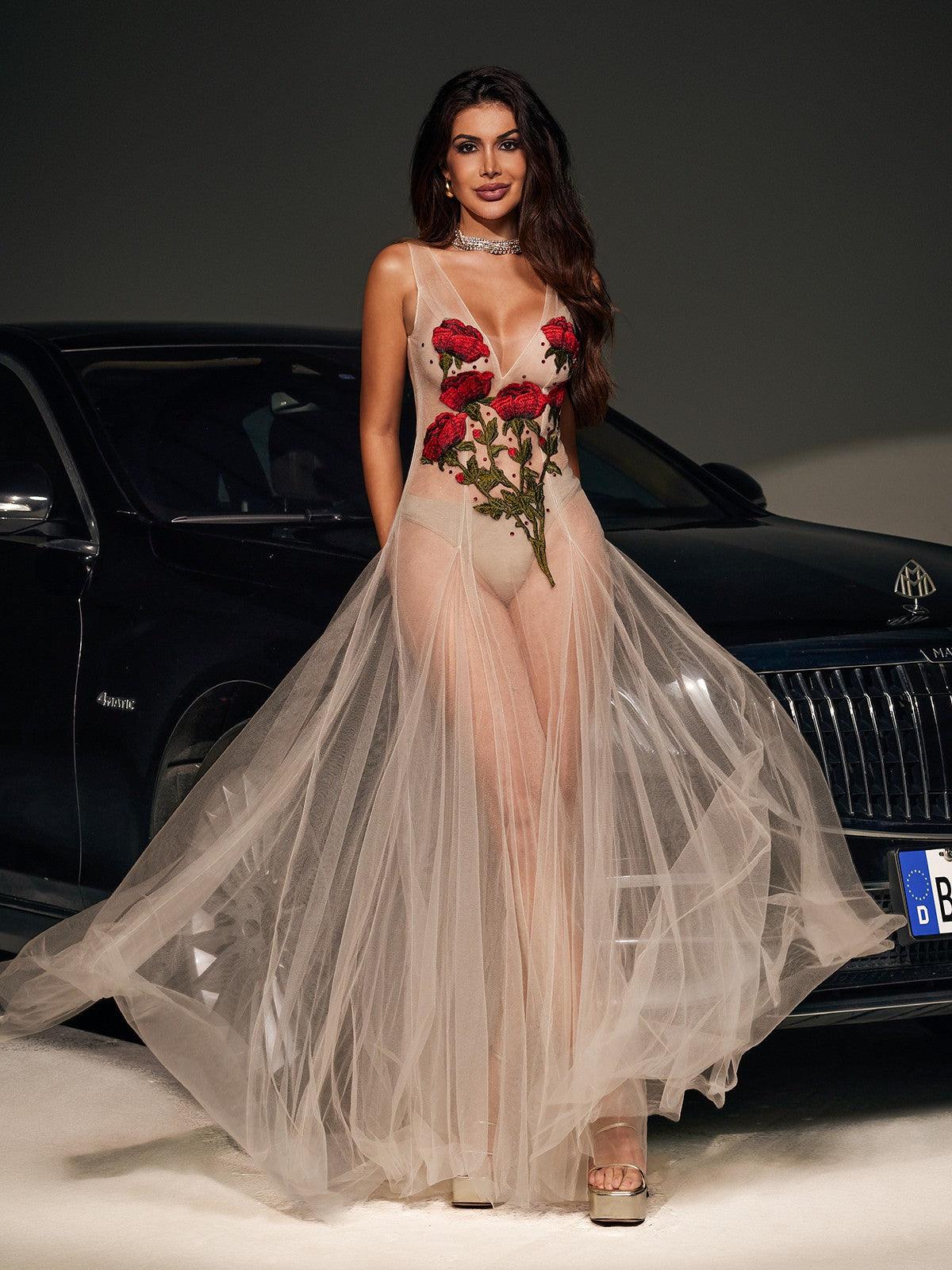 Elegant Kateri V-neck maxi dress in nude mesh with exquisite floral embroidery.  A sophisticated and romantic choice for weddings, parties, and special occasions.