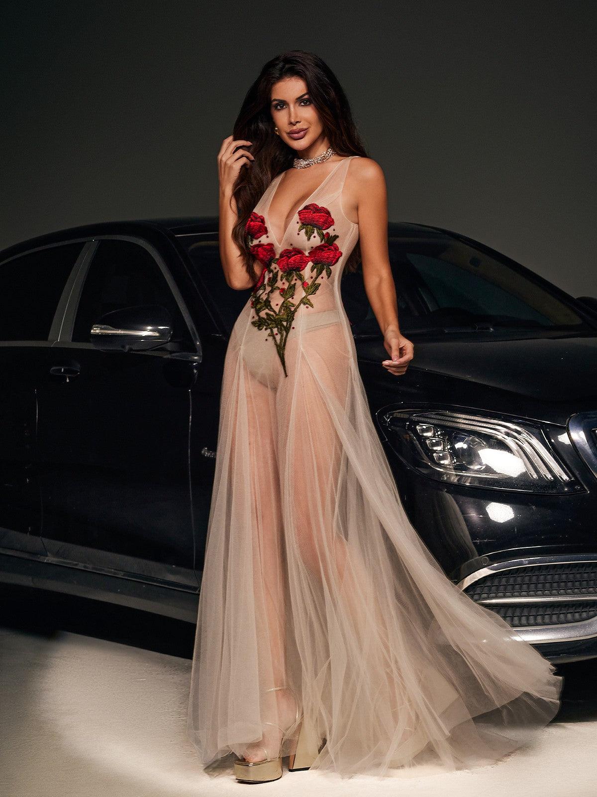 Elegant Kateri V-neck maxi dress in nude mesh with exquisite floral embroidery.  A sophisticated and romantic choice for weddings, parties, and special occasions.