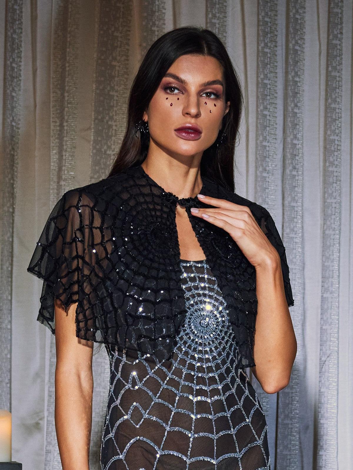 Black Kaydie Sequin Cobweb Mesh Shawl.  A delicate, sparkly shawl perfect for parties, formal events, or adding elegance to any outfit. 100% Polyester.