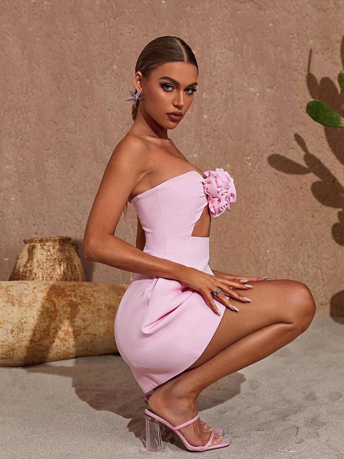 Kinsley Strapless Cutout Mini Dress in vibrant pink with unique flower embellishments, ideal for summer events.