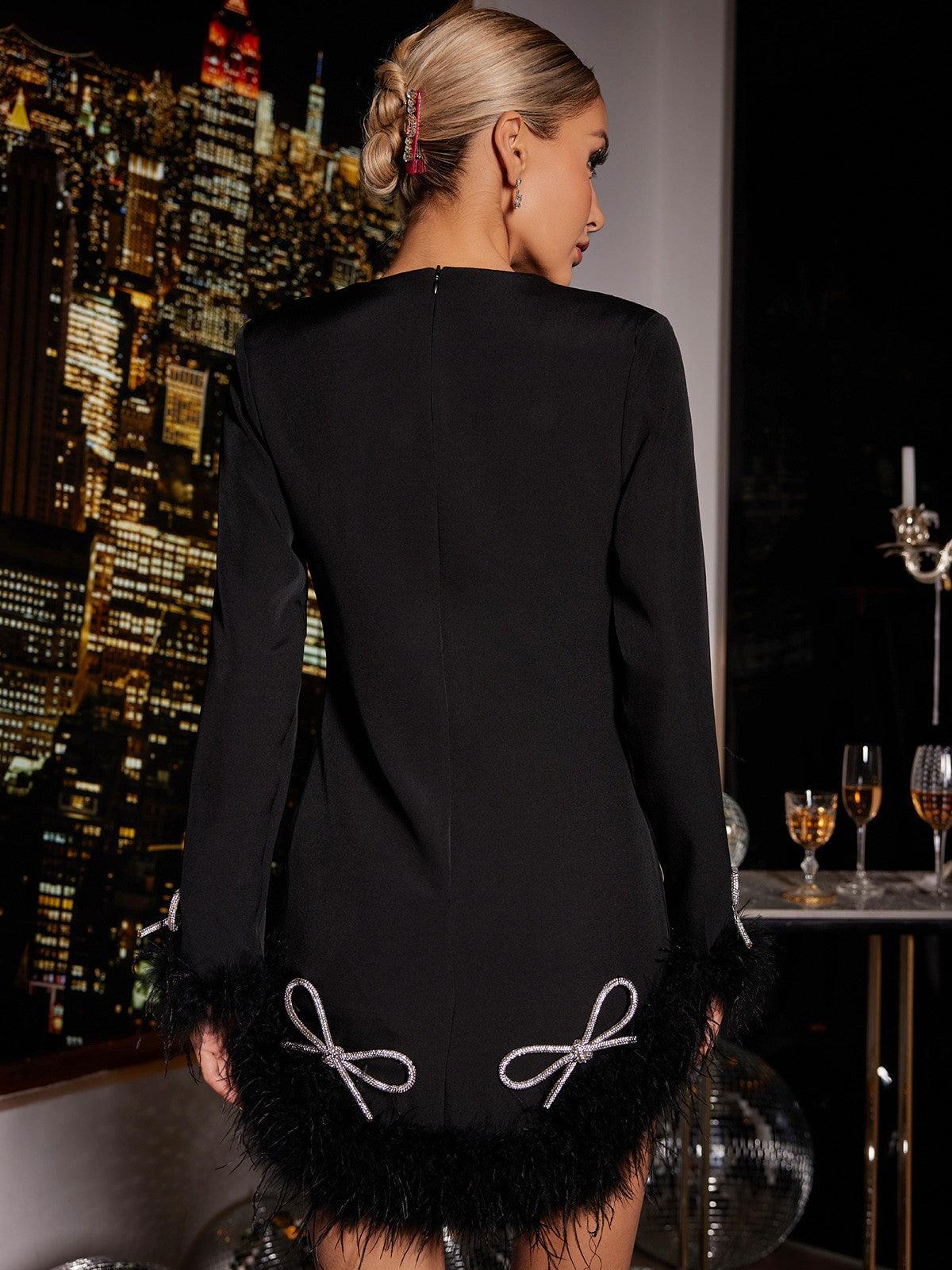 Koko Long Sleeve Bow Crystal Feather Dress featuring crystal embellishments and feather details, perfect for glamorous cocktail events.