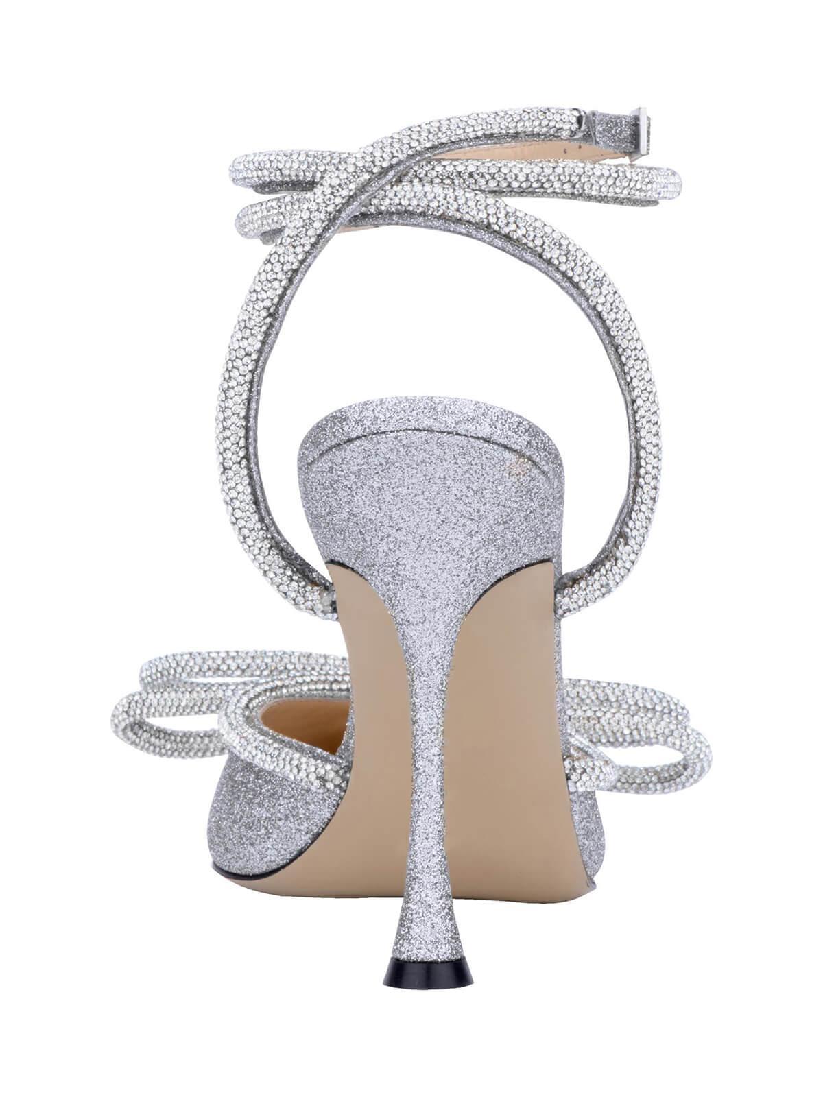 Laila Bow Crystal Satin Heels in Silver, featuring a chic design with crystal embellishments and elegant ankle strap.