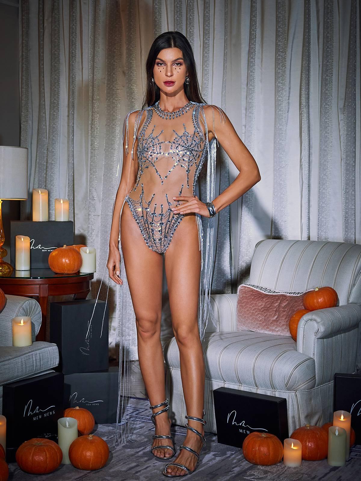 Lamia Cobweb Fringe Sequin Bodysuit featuring elegant sequin details, fringe accents, and mesh in a stylish nude color.
