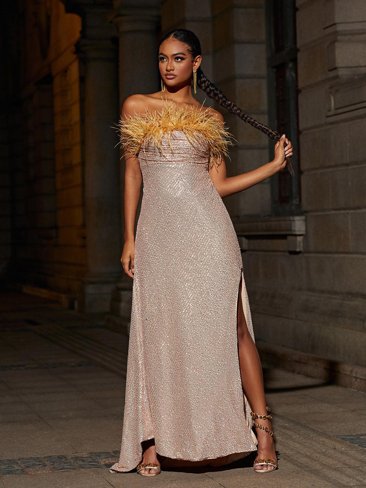 Laurell Strapless Feather Sequin Maxi Dress featuring a split design and luxurious sequins for an elegant evening look.