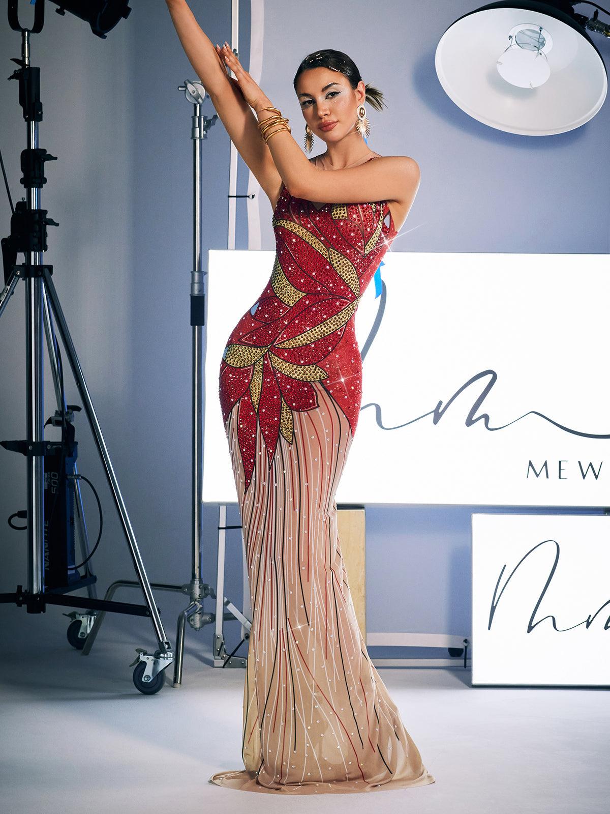 A stunning model wears the Leofric Crystal Pearl Embellished Maxi Dress, a luxurious red maxi dress adorned with crystals and pearls, perfect for special occasions.
