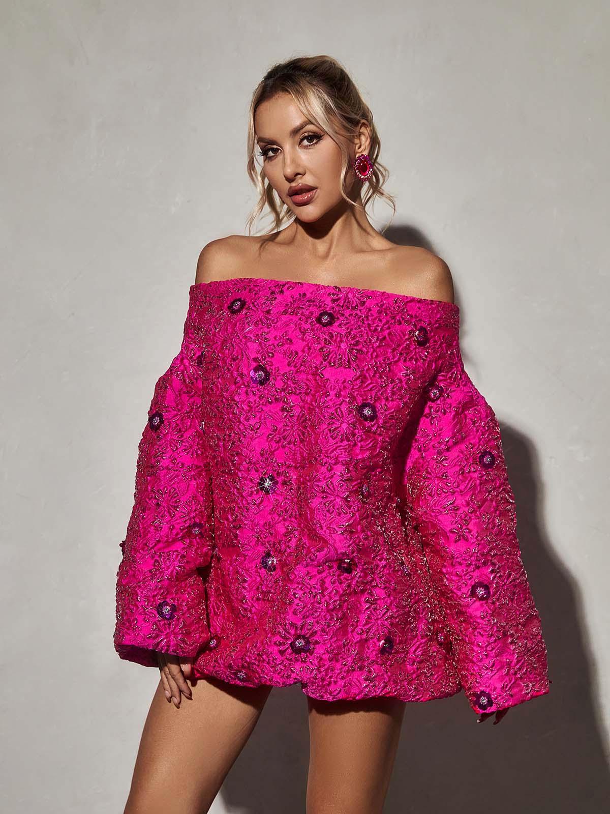 Close-up of the floral jacquard fabric on the Aanya Long Sleeve Mini Dress, highlighting its intricate design.