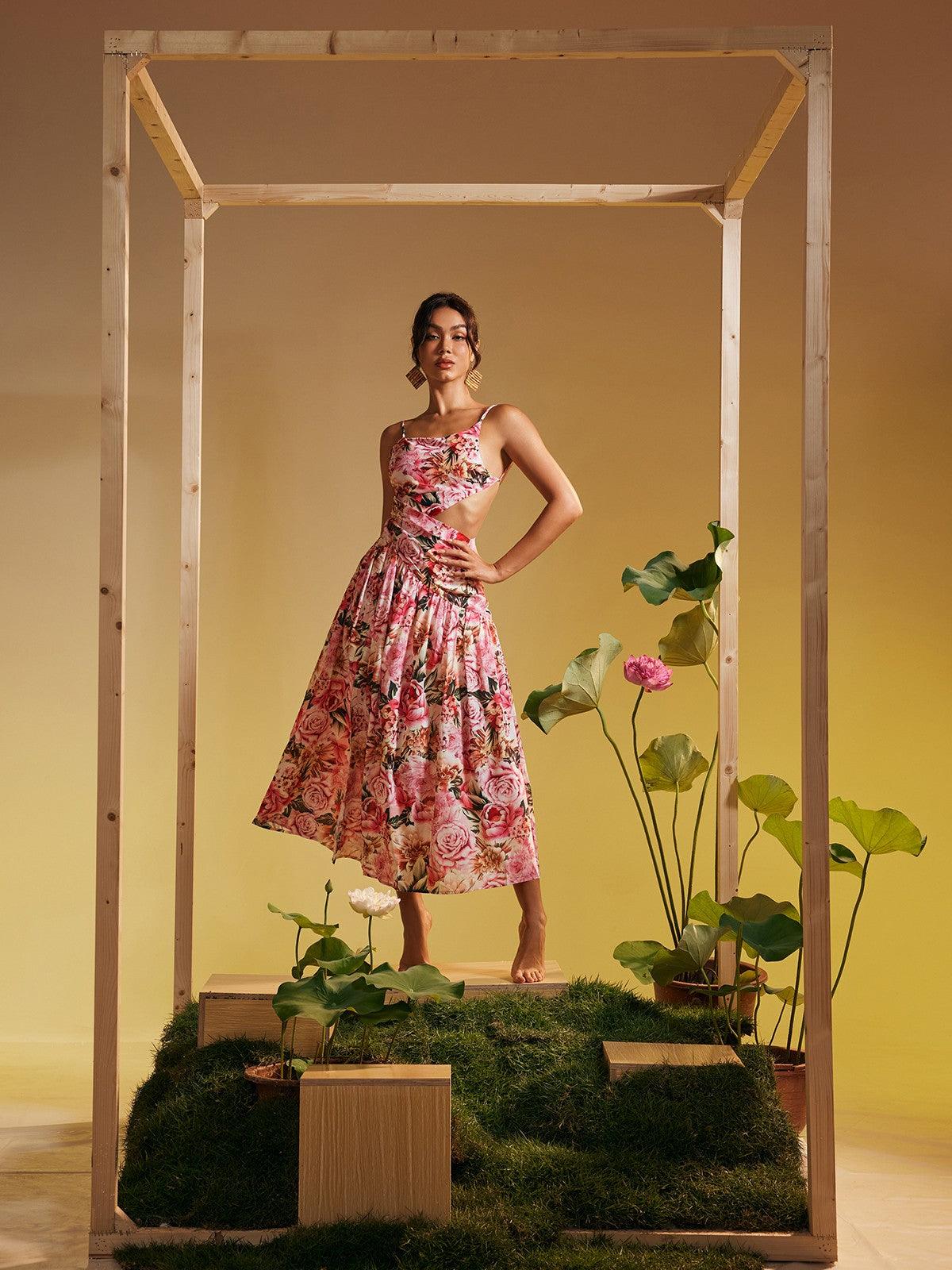 Model wearing the Acie Spaghetti Floral Print Midi Dress, showcasing its flattering fit and stylish spaghetti straps for casual outings.