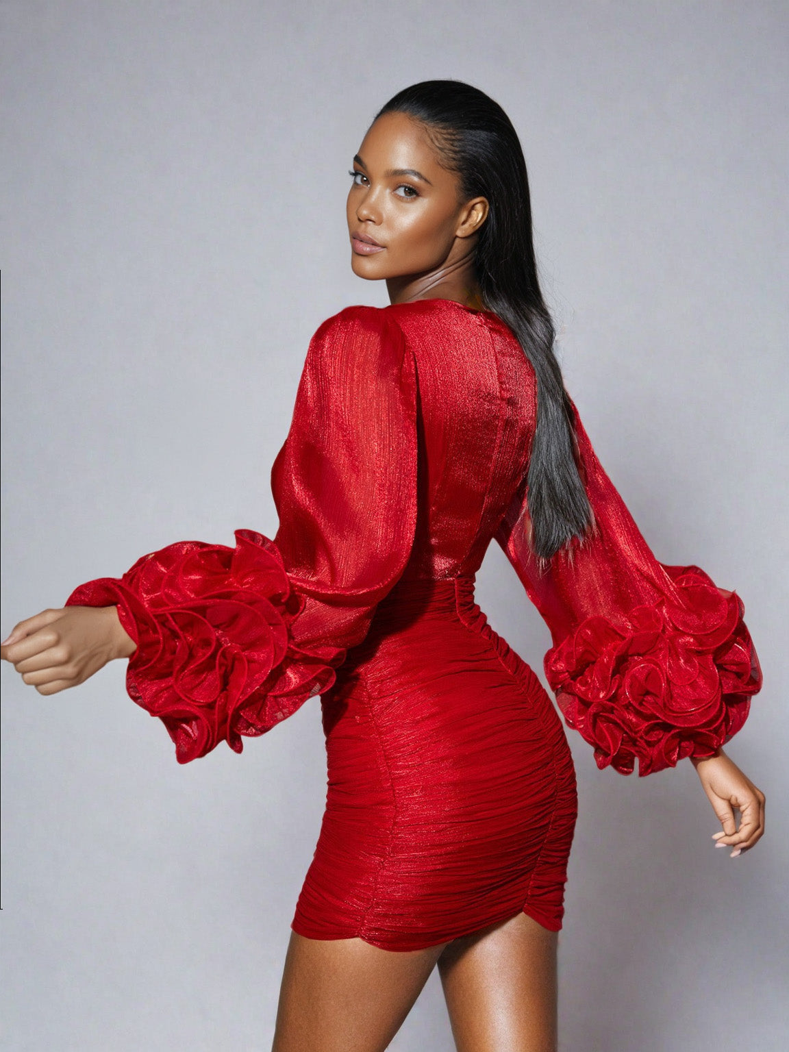 Model showcasing the Anneline V Neck Ruched Mini Dress in vibrant red, featuring a flattering fit and stylish ruched design.