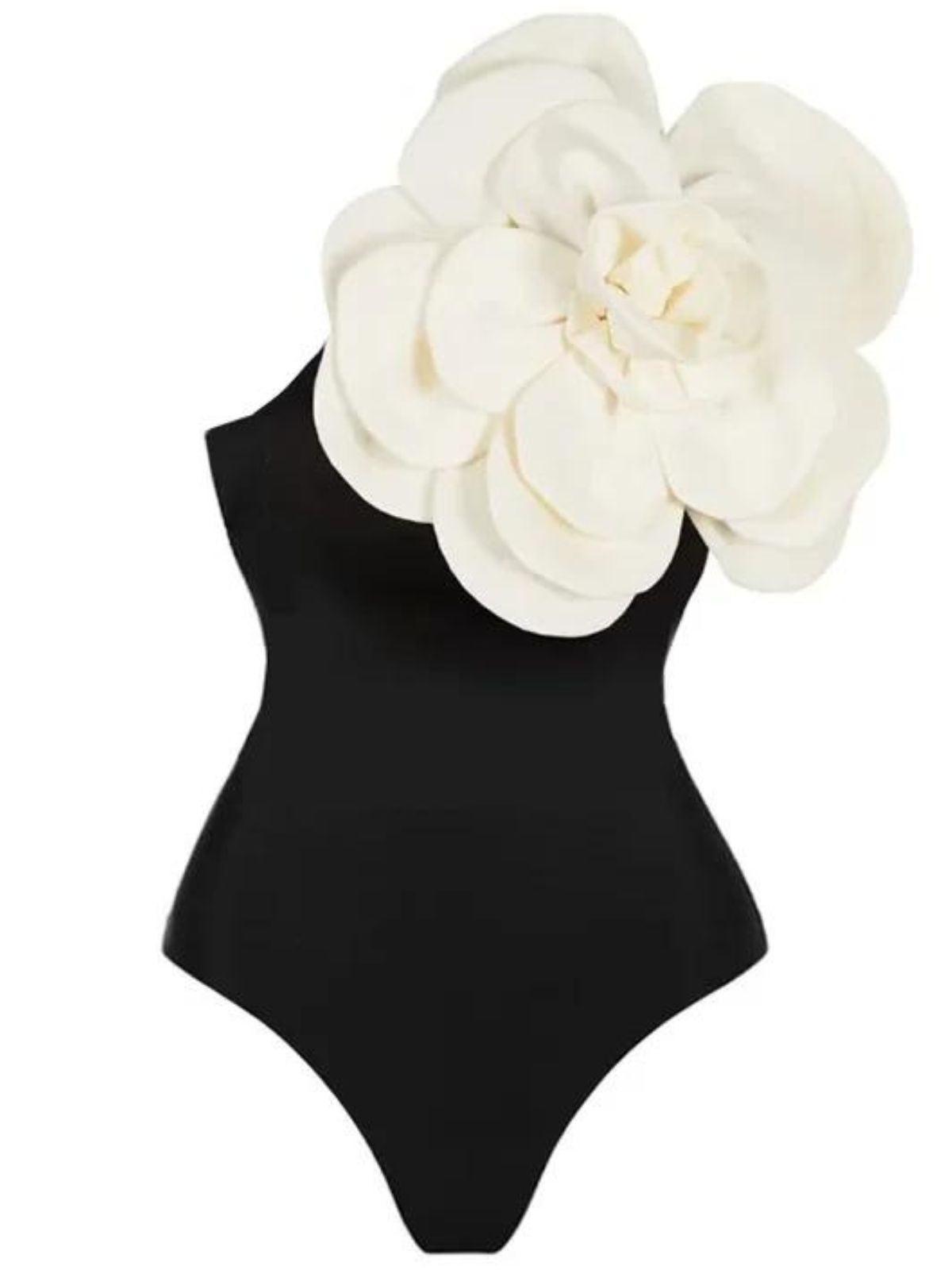 Aureliana Flower One Piece Swimsuit in Black, featuring a chic floral design and one-shoulder style, perfect for summer poolside fashion.